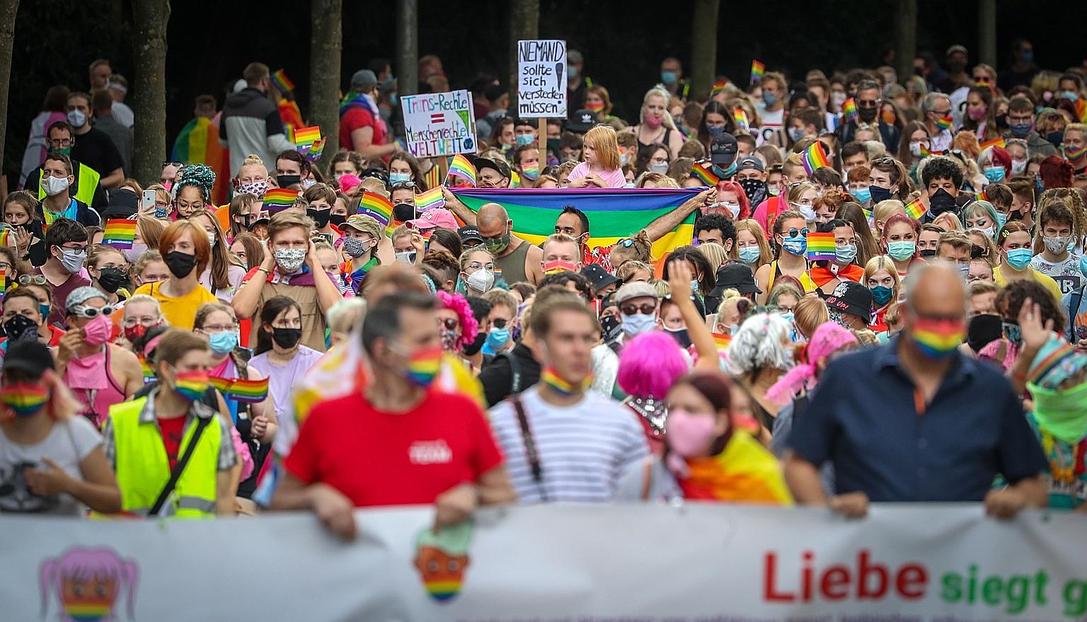 Members of the LGBT community at a march yesterday in Bremen, Germany. The country's measures include the use of face masks, restricting operations of bars and restaurants, and quarantining travellers on their return.