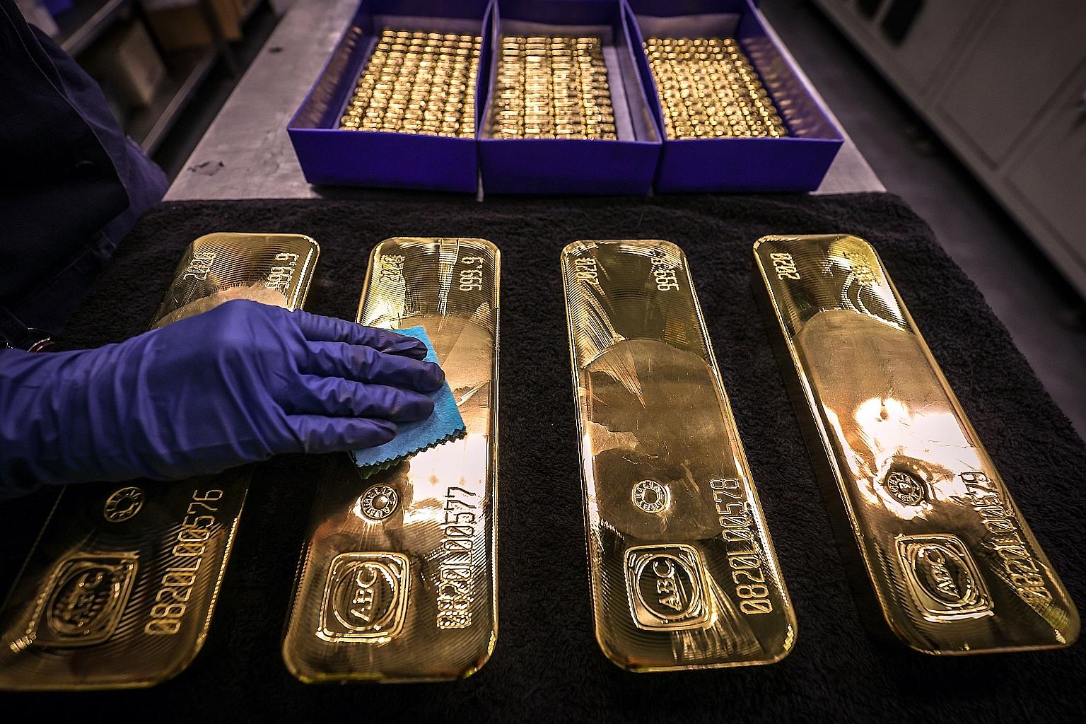 A worker polishing gold bars at the ABC Refinery in Sydney. Switzerland's banks have always been deemed a safe haven for assets and precious metals, but, in recent years, many people started to lose faith in banks and there has been a rising demand f