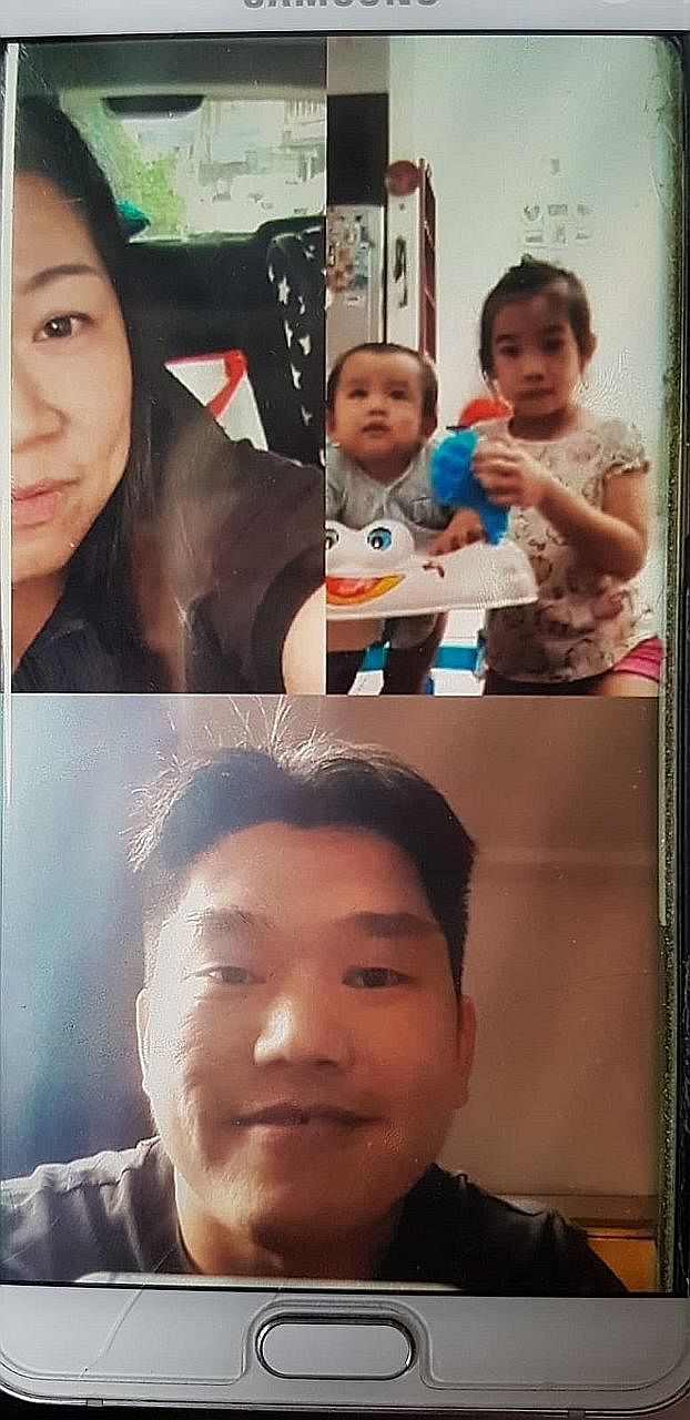 Mr Eddie Chow, seen below in a video call with his family, said his wife "is being left alone to take care of our eight-month-old son and five-year-old daughter". PHOTOS: GAIN CITY