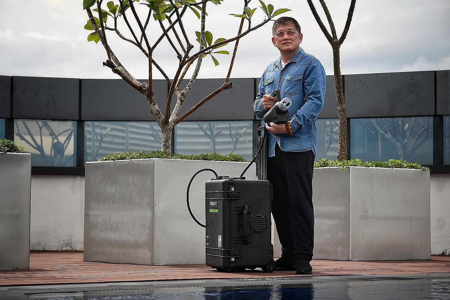 With his Oman projects halted, Mr Nicholas Koh has ventured into new businesses, including marketing the Tomi SteraMist, a decontamination solution from the United States. Ms Reene Ho-Phang and her husband Peter Phang (both above) - who run travel ma