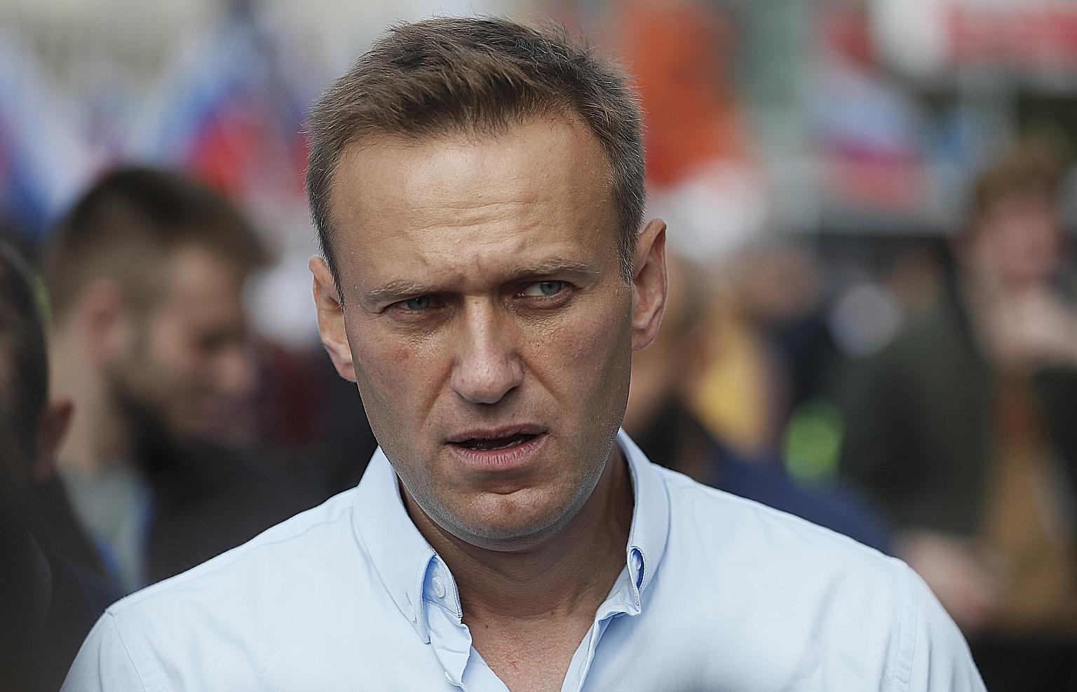 Medical specialists carrying Russian opposition leader Alexei Navalny, 44, on a stretcher into an ambulance in the Siberian city of Omsk on their way to an airport, before his medical evacuation to Berlin yesterday. He had collapsed on a plane last T