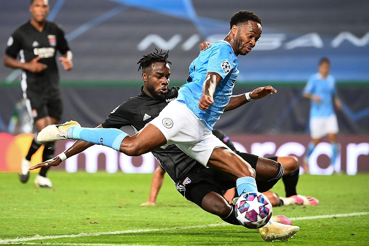Lyon's Maxwel Cornet tackling Manchester City forward Raheem Sterling during their Champions League quarter-final match in Lisbon on Aug 15. City were knocked out after losing 3-1 to the French side. PHOTO: AGENCE FRANCE-PRESSE