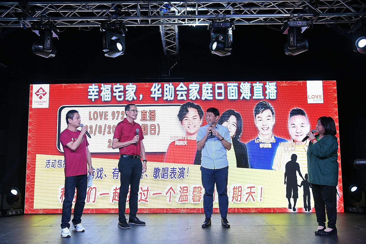 Senior Minister of State for Foreign Affairs and Transport Chee Hong Tat (third from left) and Chinese Development Assistance Council executive director Pok Cheng Chong (second from left) at a CDAC family day event hosted by deejays Dennis Chew (left