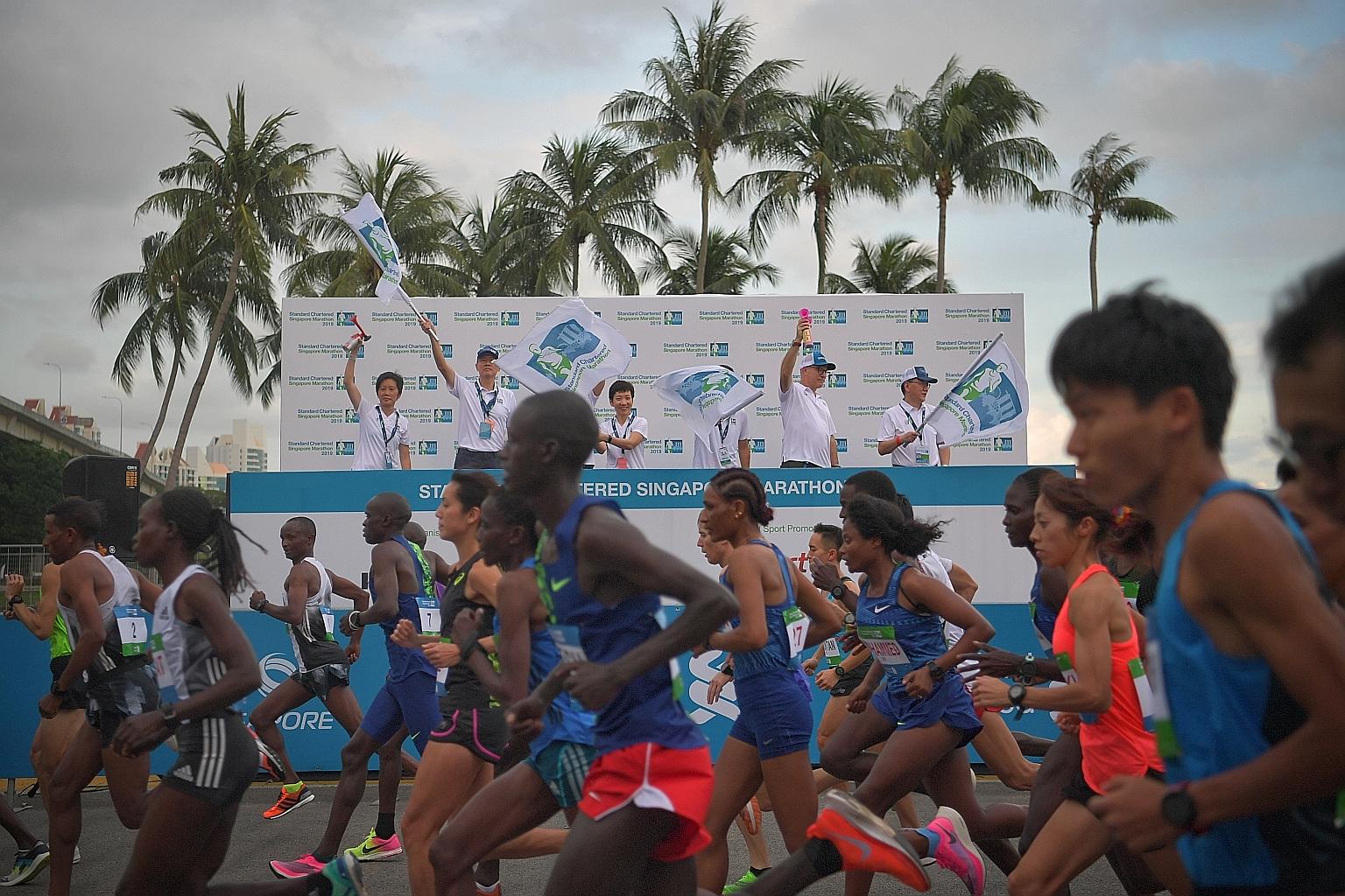 Then Minister for Culture, Community and Youth Grace Fu flagging off the Standard Chartered Singapore Marathon last year. The event attracted over 50,000 participants, with more than 70,000 supporters lining the route. ST PHOTO: ARIFFIN JAMAR