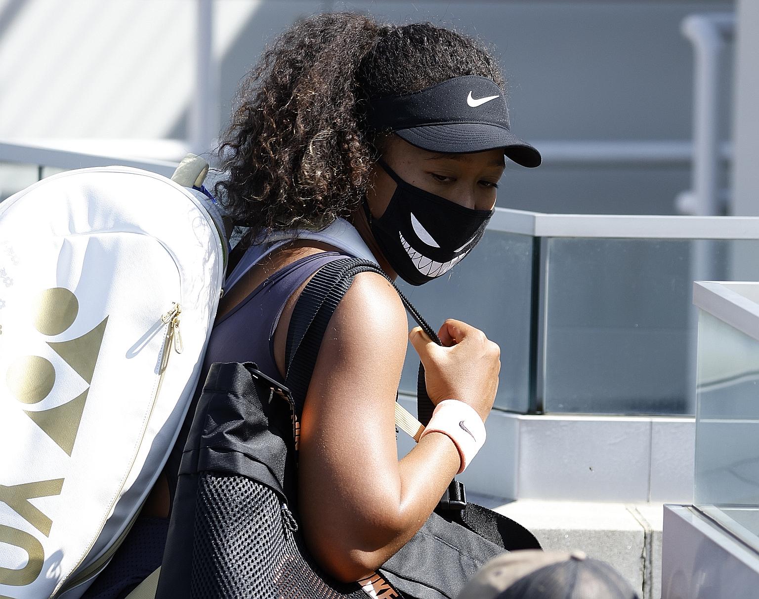 Naomi Osaka walking off the court after defeating Anett Kontaveit in the Western and Southern Open quarter-finals on Wednesday. The Japanese world No. 10 wants other matters, such as racial injustice, to get more attention than tennis. PHOTO: EPA-EFE