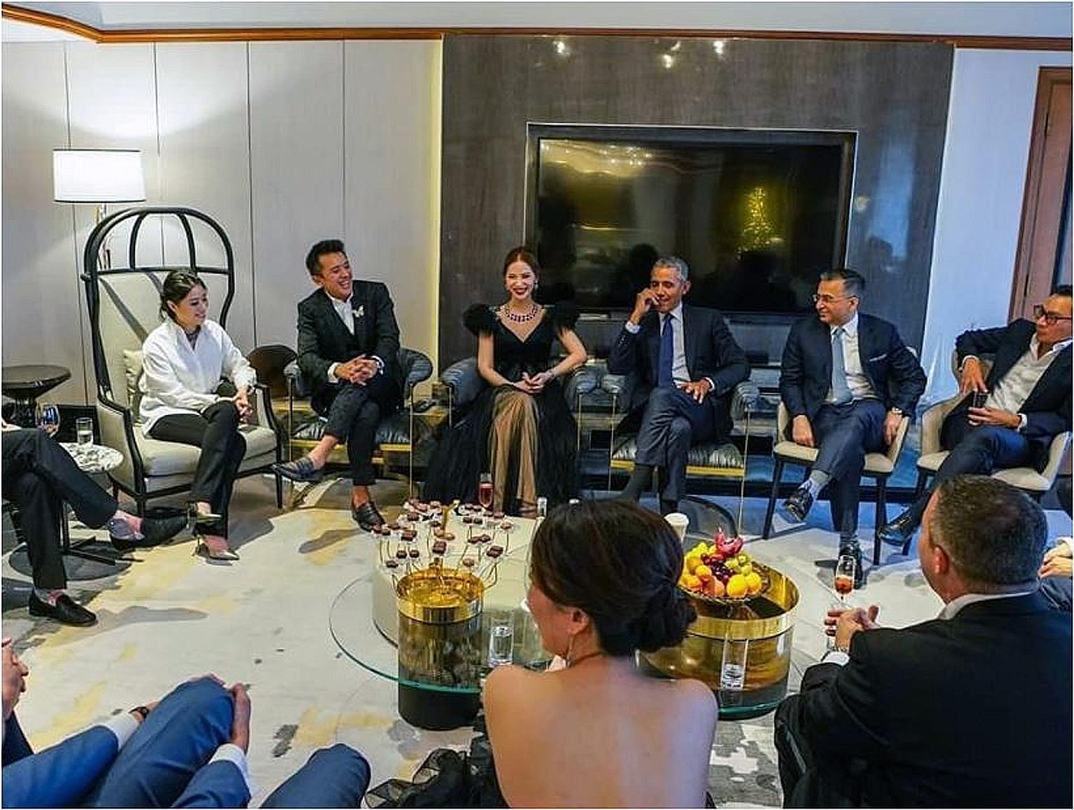 Axington's director Evangeline Shen (third from left) and co-owners Nelson Loh (second from left) and Terence Loh (at right) are in the news for doctored photos with Mr Barack Obama (fourth from left). PHOTO: BELLAGRAPH NOVA GROUP