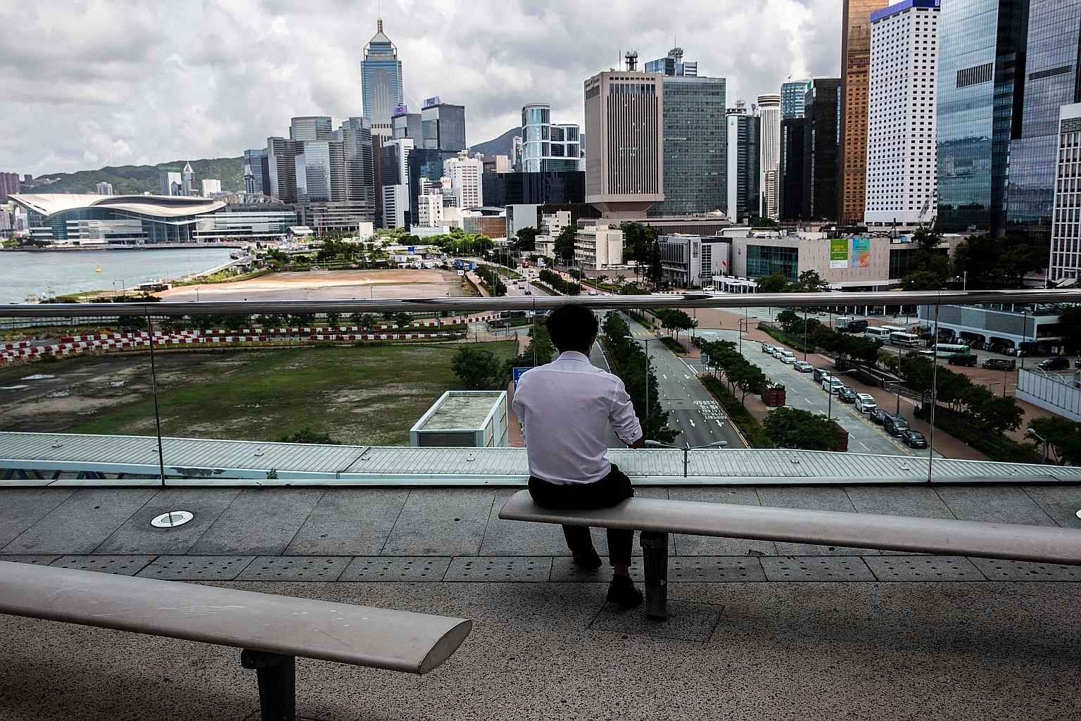 Commercial buildings in Hong Kong's Central district. Last month alone, Chinese buyers snapped up at least two office towers and one hotel building in Hong Kong worth HK$4 billion (S$702 million) in total, according to agents and filings.