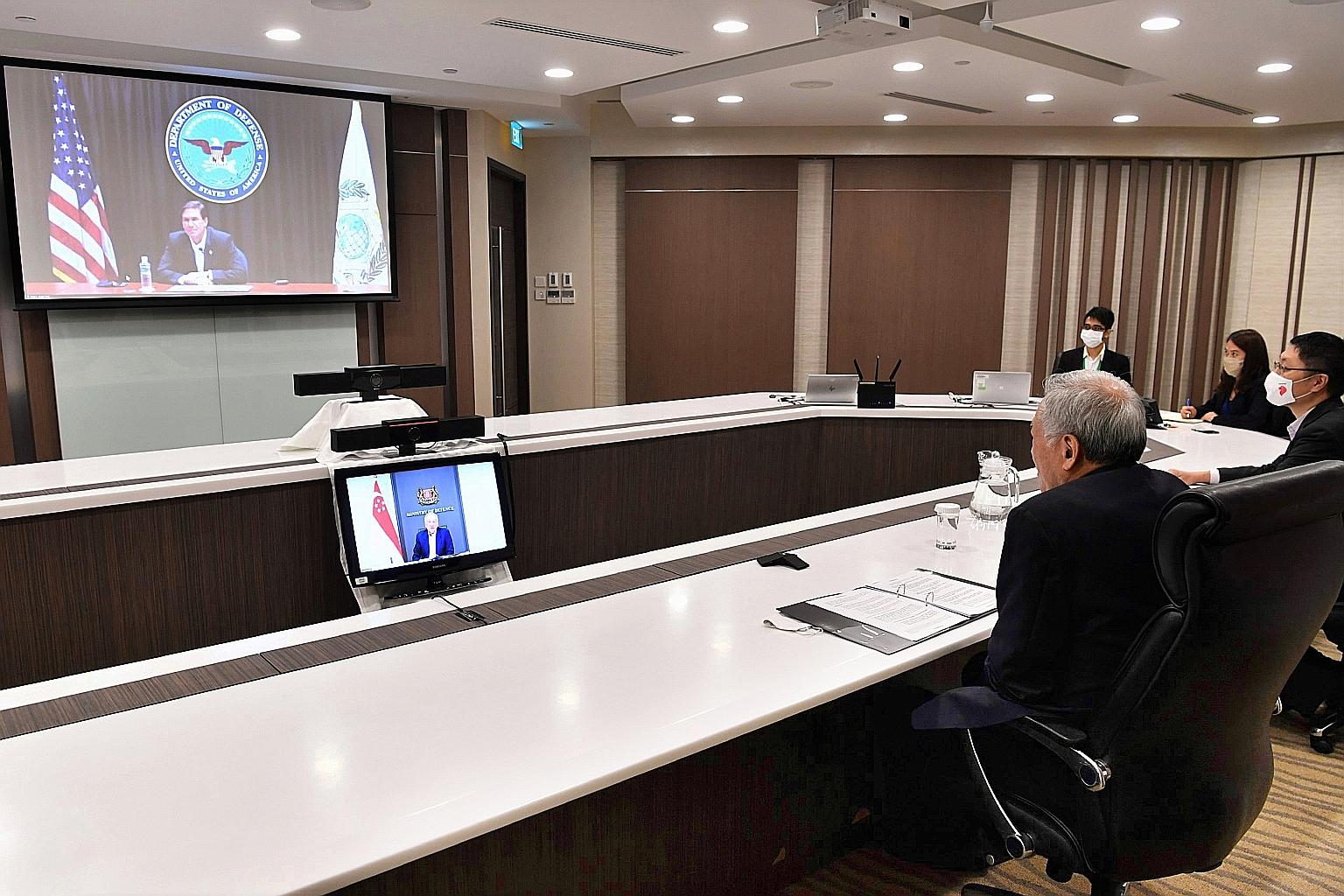 Defence Minister Ng Eng Hen and US Defence Secretary Mark Esper in a videoconference yesterday. Both sides reaffirmed the importance of the US' continued engagement of the region.