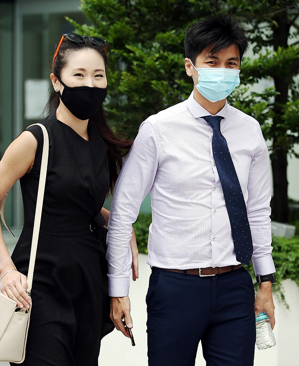 Marathoner Ashley Liew, 33, and wife Sandra Faustina Lee outside the State Court yesterday. He is accusing former teammate Soh Rui Yong of defaming him and is seeking $120,000 in damages. ST PHOTO: WONG KWAI CHOW