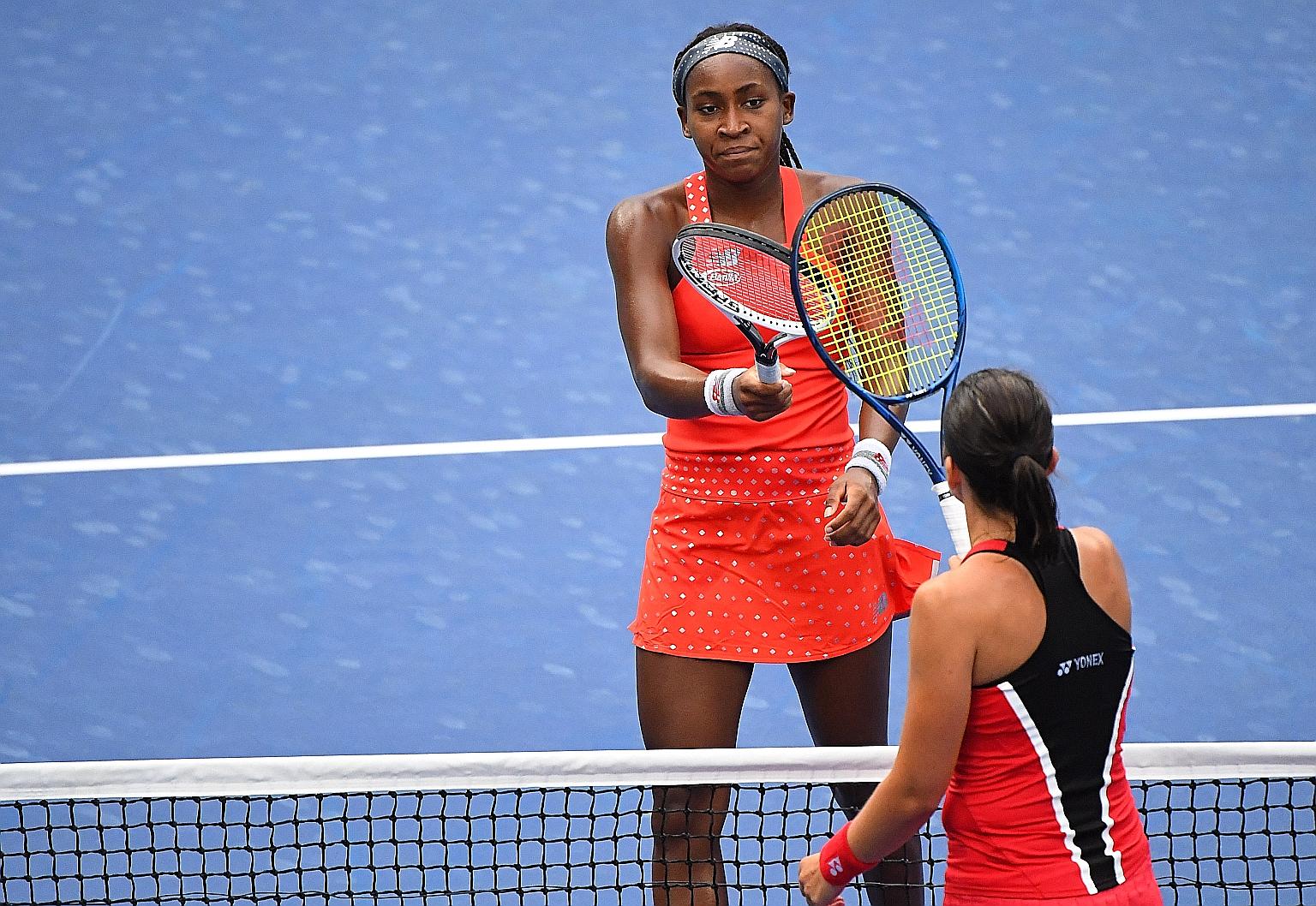 American Coco Gauff greeting Anastasija Sevastova of Latvia at the net following their match. PHOTO: REUTERS