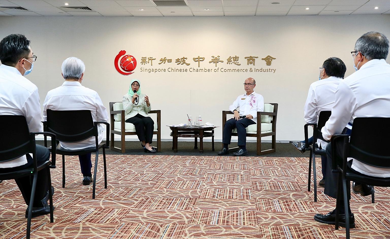 President Halimah Yacob speaking at a dialogue with members of the Singapore Chinese Chamber of Commerce and Industry yesterday. She later said that based on discussions and feedback during the session, companies are exploring new opportunities, such
