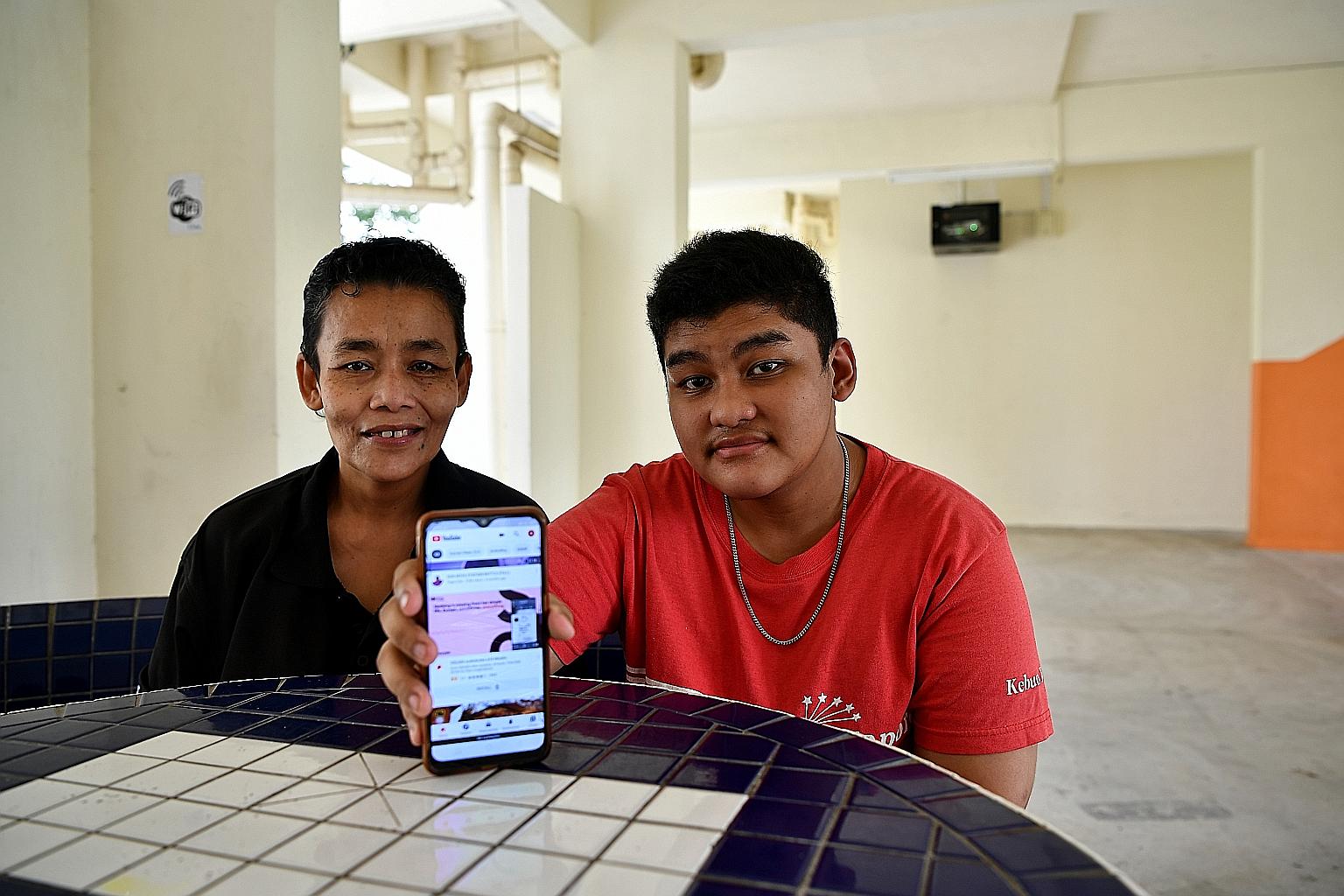 Madam Siti Aidah Abdullah and her son Mohamed Shazwan Mohamed Awal are among 300 homes in blocks 244 and 245 Ang Mo Kio Avenue 3 that can now tap free Internet access at the void deck of Block 245 with the installation of high-speed fibre broadband b