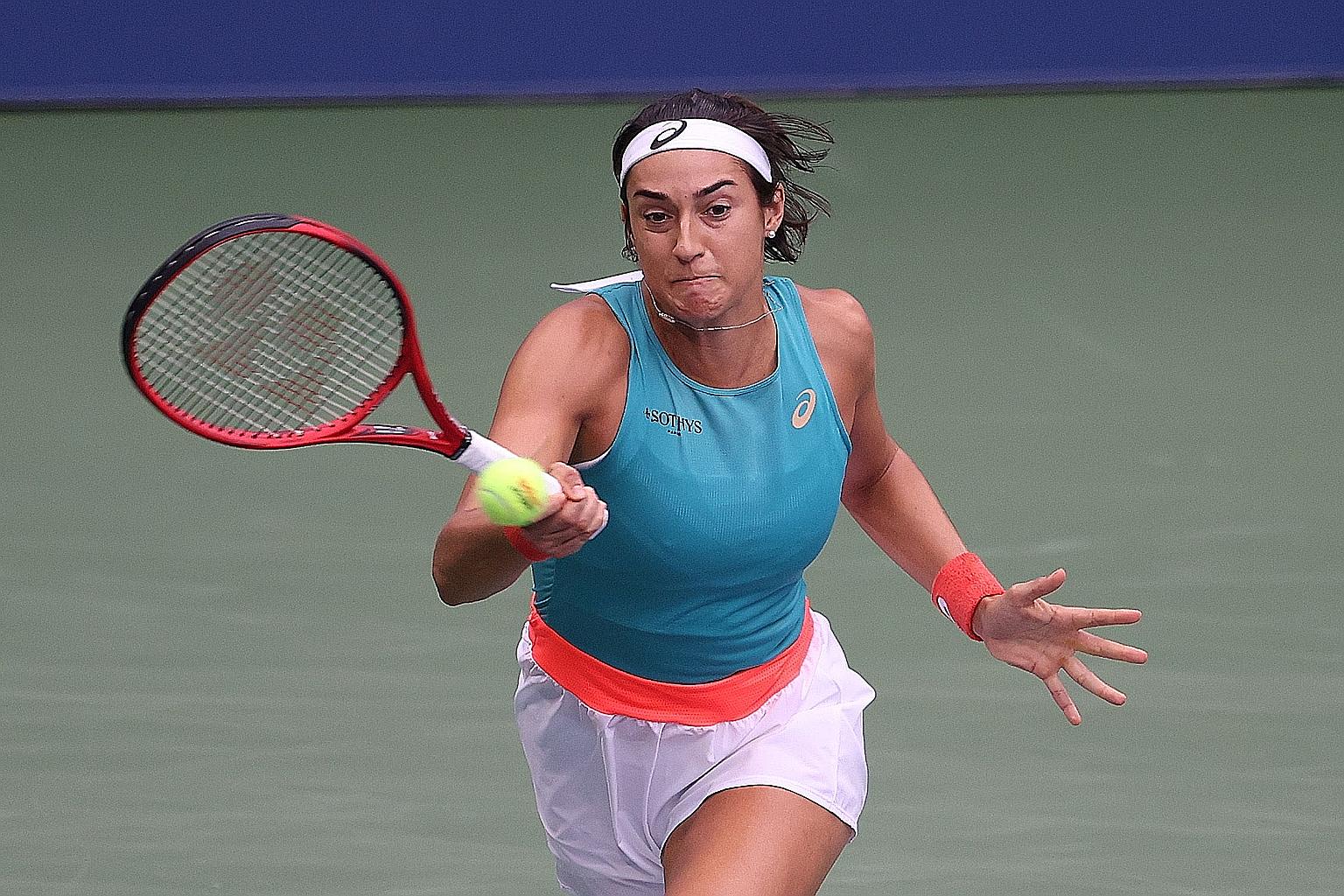 Caroline Garcia of France returning the ball during her US Open second-round match on Wednesday against top seed Karolina Pliskova of the Czech Republic. The Frenchwoman won 6-1, 7-6 (7-2). PHOTO: AGENCE FRANCE-PRESSE