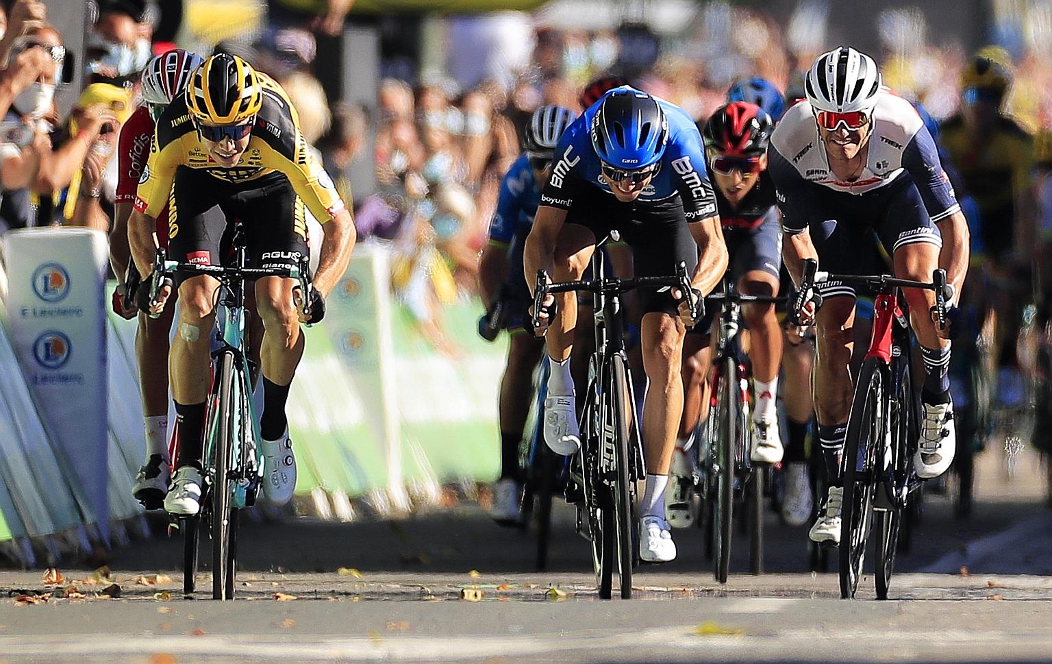Wout van Aert (left) of Team Jumbo-Visma outsprinting the rest of the peloton to win the seventh stage of the Tour de France yesterday. PHOTO: EPA-EFE