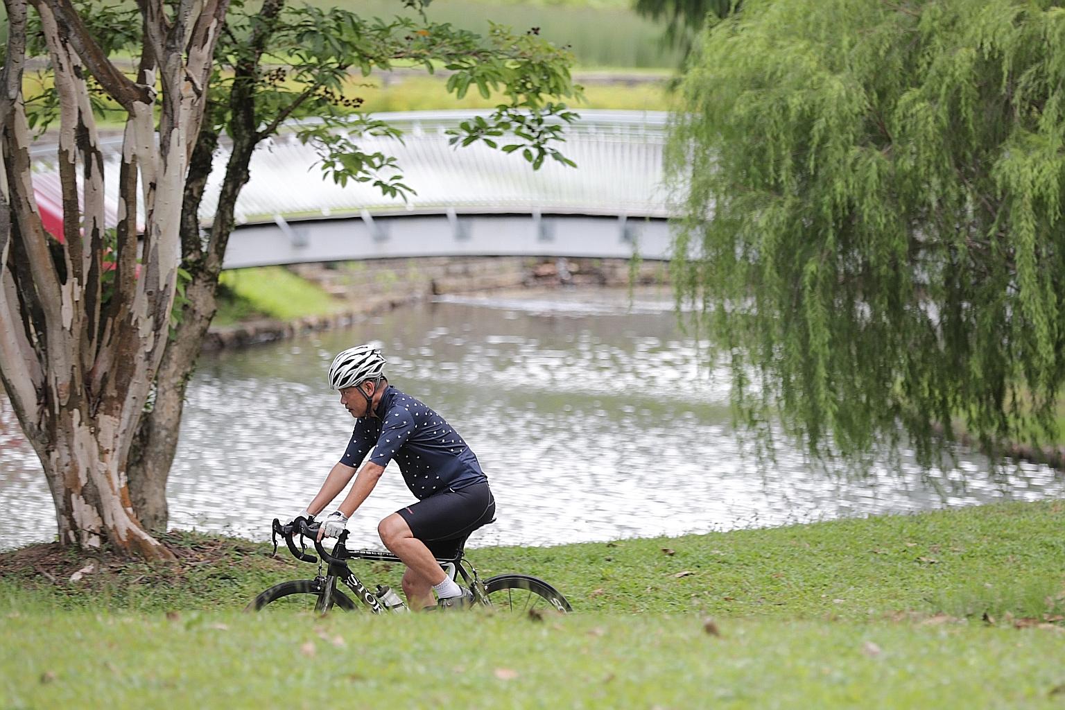 A cyclist at Bishan-Ang Mo Kio Park. While any form of physical activity is better than being sedentary, picking up the pace has added benefits.
