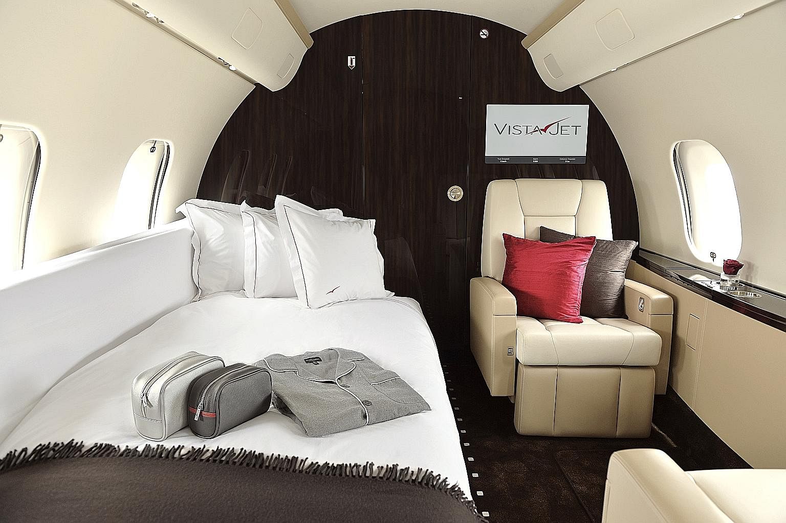 Have a nap or enjoy luxurious teatime treats aboard a VistaJet private plane. The Aman Private Jet has buttery leather seats and accommodates up to 12 passengers.