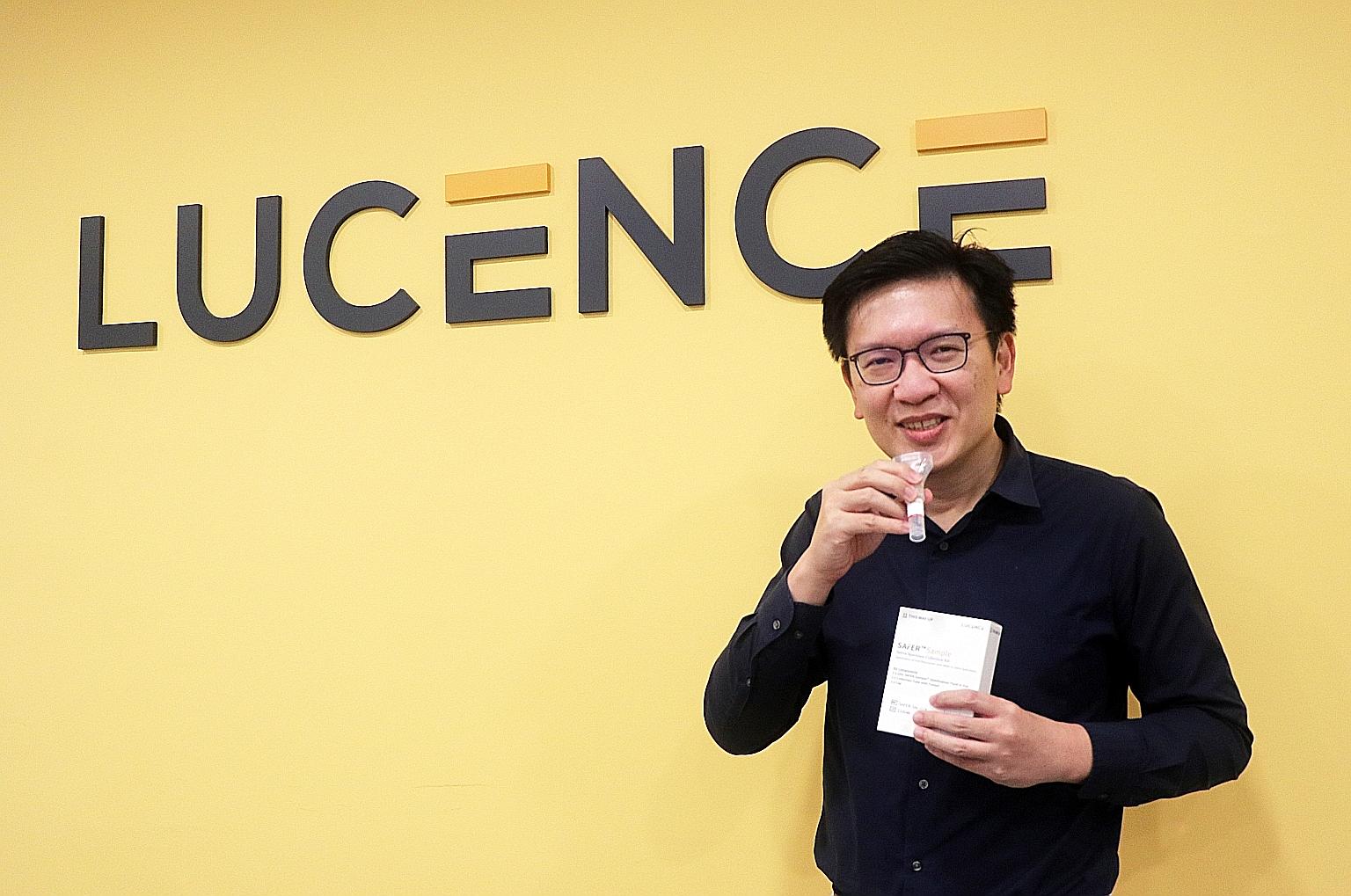 Lucence Diagnostics chief executive and medical director Min-Han Tan with the company's saliva-based testing kit. Nearly 30 per cent of the firm's current headcount was hired in the last three months. PHOTO: LUCENCE DIAGNOSTICS