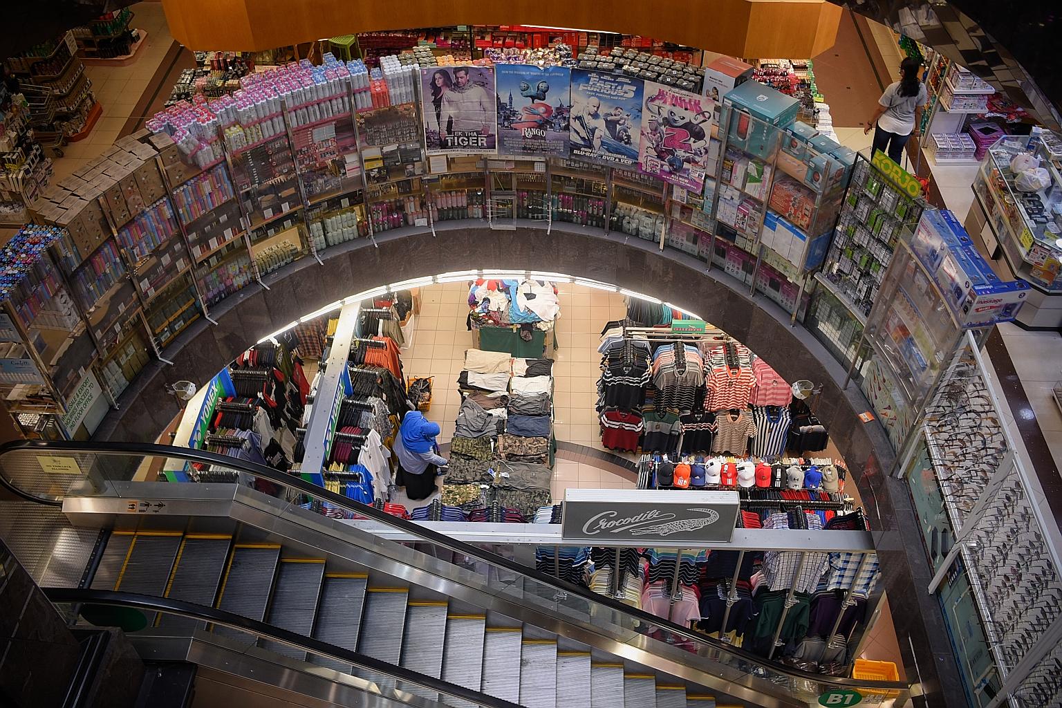 A relatively empty Mustafa Centre last week. Business at the shopping centre is still far below pre-pandemic levels, its employees say. Some staff have found temporary jobs as they wait to be called back to work.