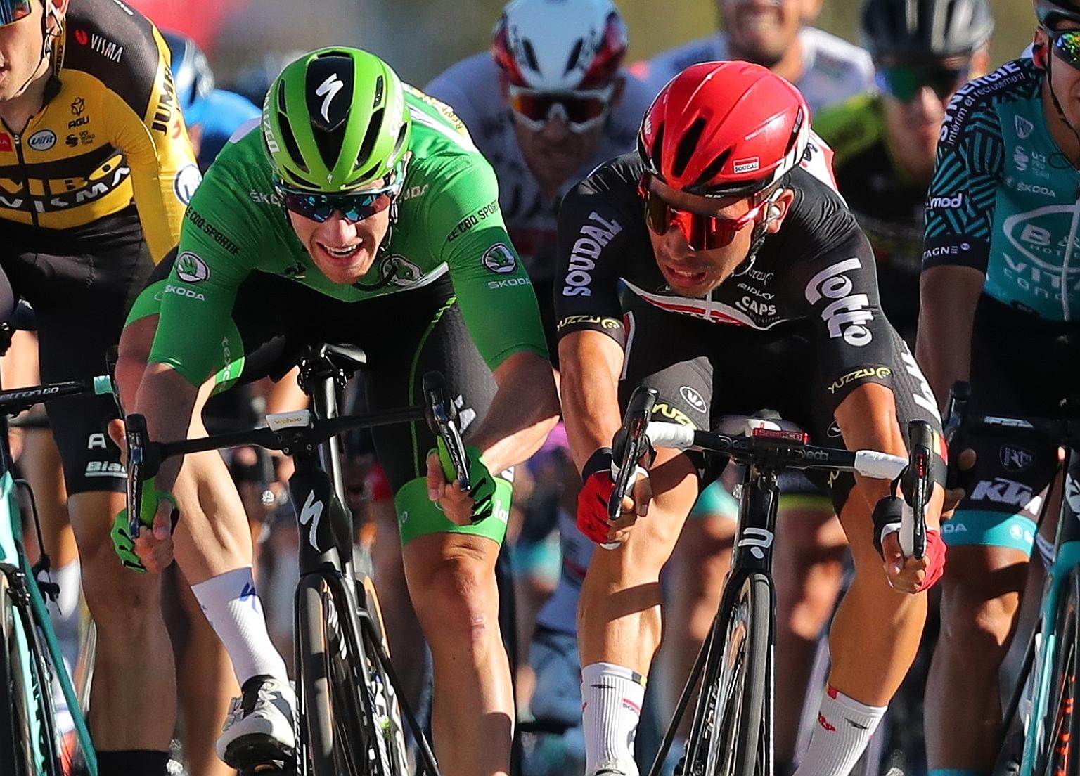 Caleb Ewan of Australia (in red helmet) and Sam Bennett of Ireland sprinting towards the line at the Tour de France in Poitiers yesterday. Ewan won the 11th stage, a 167.5km ride from Chatelaillon-Plage. Slovak Peter Sagan was second and Bennett thir