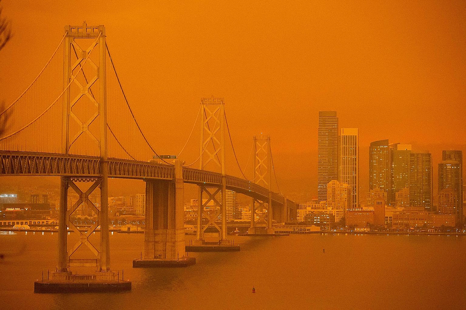 The San Francisco Bay Bridge and city skyline obscured in smoke and haze on Wednesday. PHOTO: AGENCE FRANCE-PRESSE