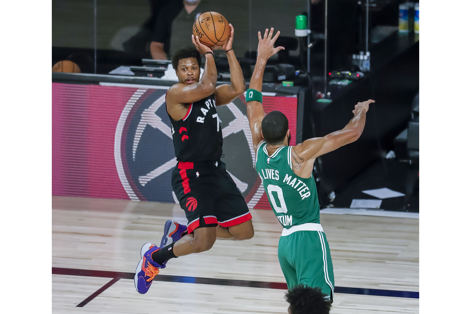 Raptors' Kyle Lowry looking for a way past Celtics forward Jayson Tatum. The Toronto guard finished with a game-high 33 points. PHOTO: EPA-EFE