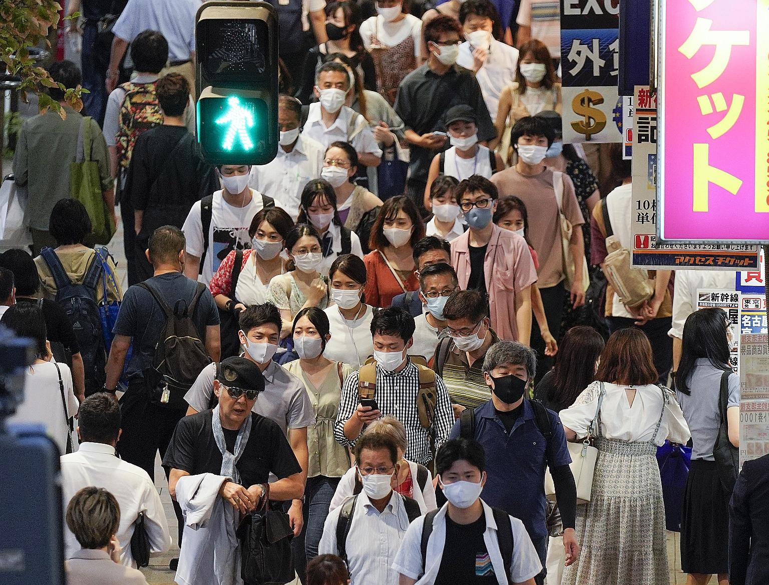 The bustle in the Shinjuku business district in Tokyo on Thursday. Singapore has similar arrangements with other countries, but this is the first such framework that Japan will implement with another country.
