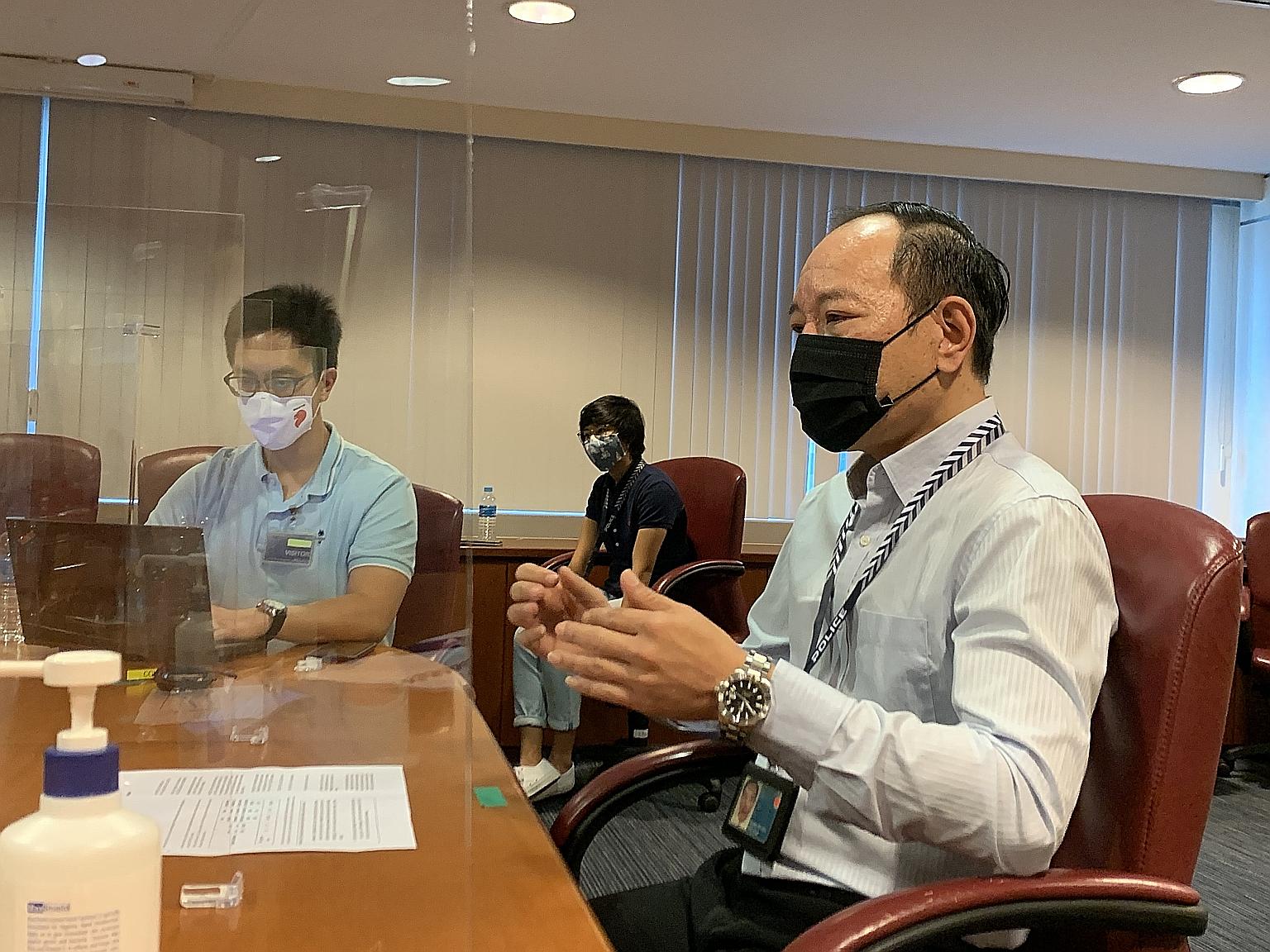 Mr Alan Kit (right) of the Commercial Affairs Department said at a media briefing yesterday that cases involving scammers posing as tech support staff are on the rise now that many people are working from home.