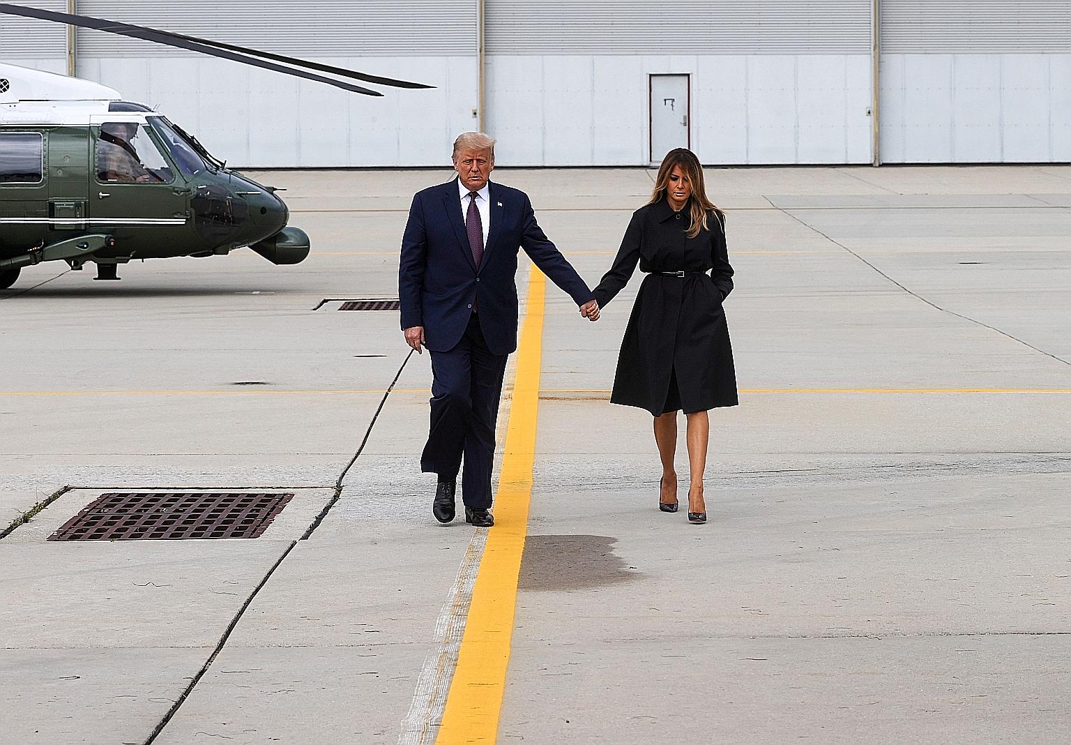 US President Donald Trump and his wife Melania Trump walking to board Air Force One to return to Washington after taking part in a Sept 11 remembrance ceremony at the Flight 93 National Memorial in Pennsylvania on Friday. PHOTO: REUTERS
