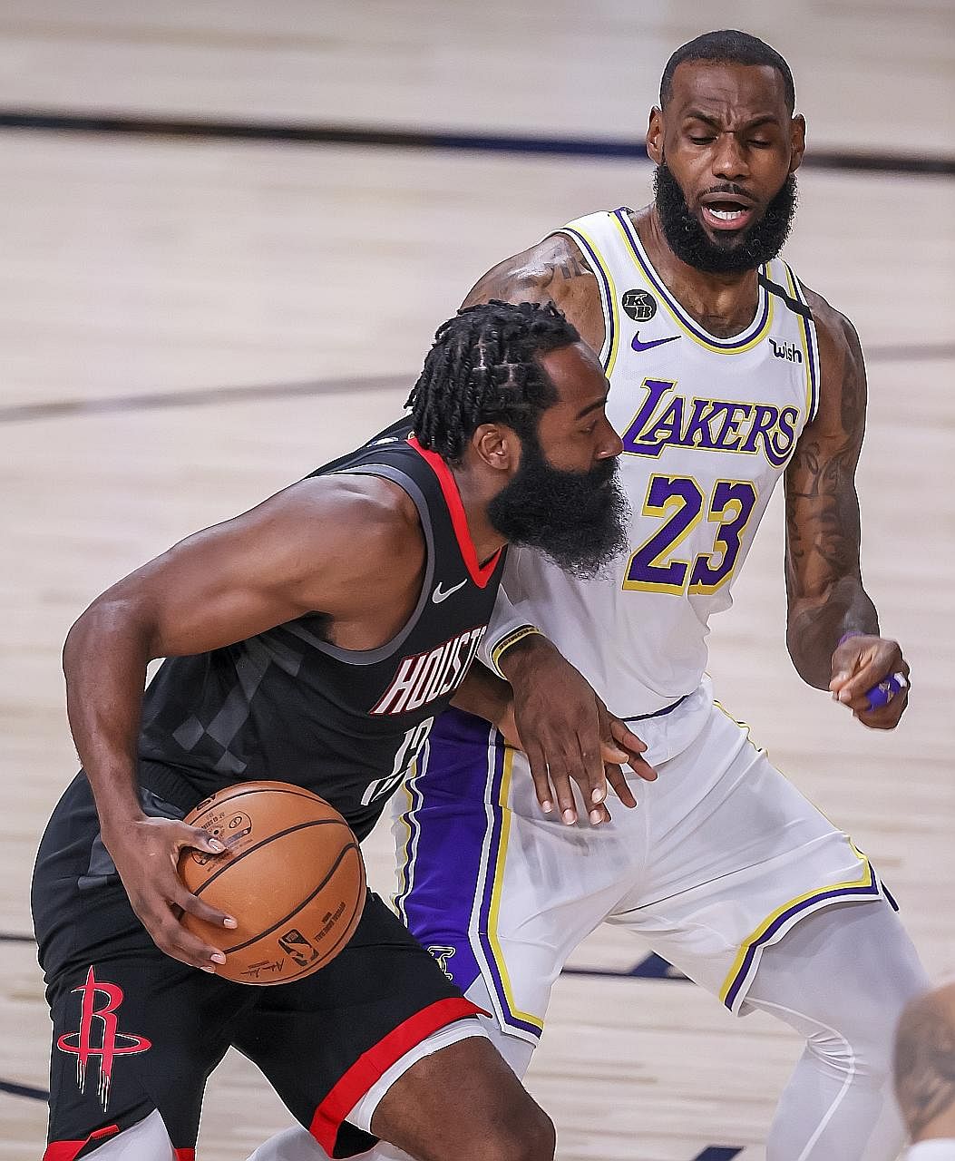 Rockets guard James Harden taking on Lakers forward LeBron James in Game 5 of their Western Conference semi-finals. The Lakers cruised to a 119-96 victory to win the series 4-1. PHOTO: EPA-EFE