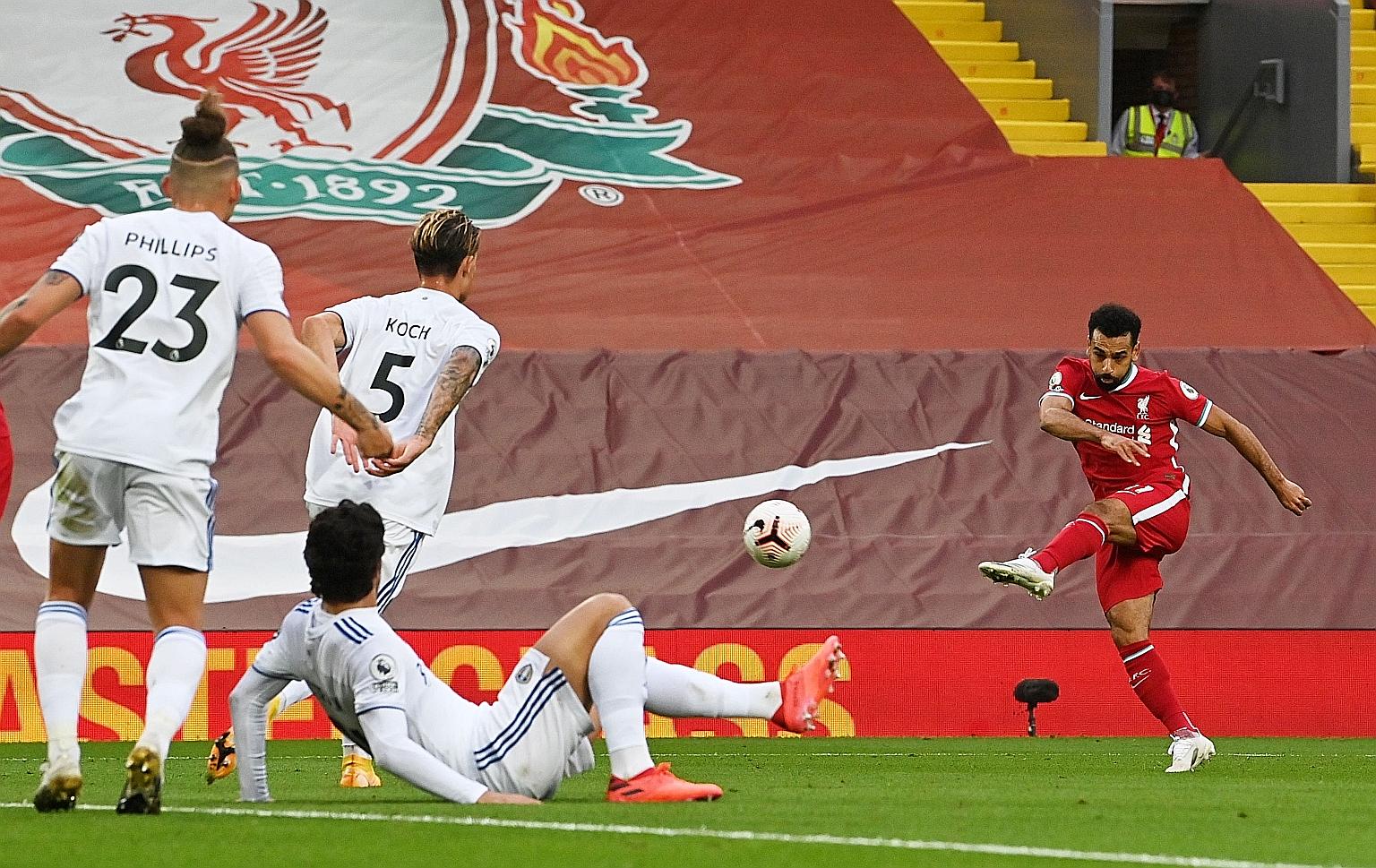 Mohamed Salah rifling in his second goal to put Liverpool 3-2 up. Leeds pegged back the Reds each time they led and it took the Egyptian's second penalty to give them full points. PHOTO: REUTERS
