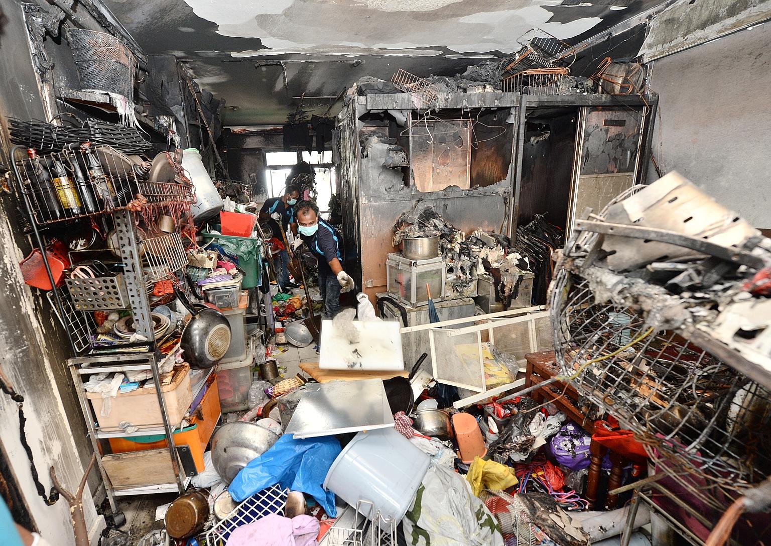 The charred remains of a family's belongings in a Bukit Batok flat after a fire broke out last November. Firemen attending to the fire found that hose reel cabinets in the vicinity had been padlocked and that hose reels were dry. Such incidents in th