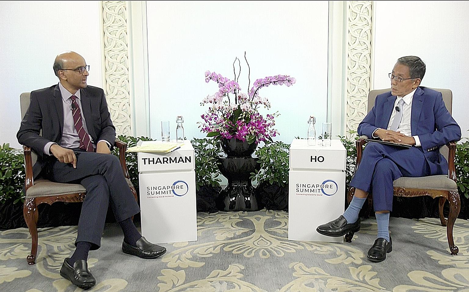 Senior Minister Tharman Shanmugaratnam with Banyan Tree Holdings executive chairman Ho Kwon Ping, who moderated yesterday's session at the Singapore Summit on the topic of Anticipating A New World. Mr Tharman said Singapore has to stay open to maximi