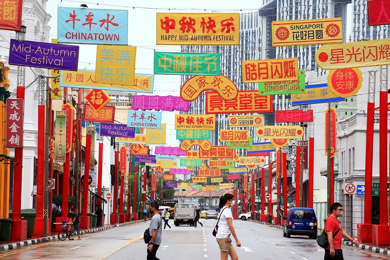 One of the banner-like lanterns has a message that translates into "bright and majestic", while another says "joy for the nation" - both phrases are not commonly used to celebrate the Mid-Autumn Festival, which is a time for family reunions. PHOTO: L