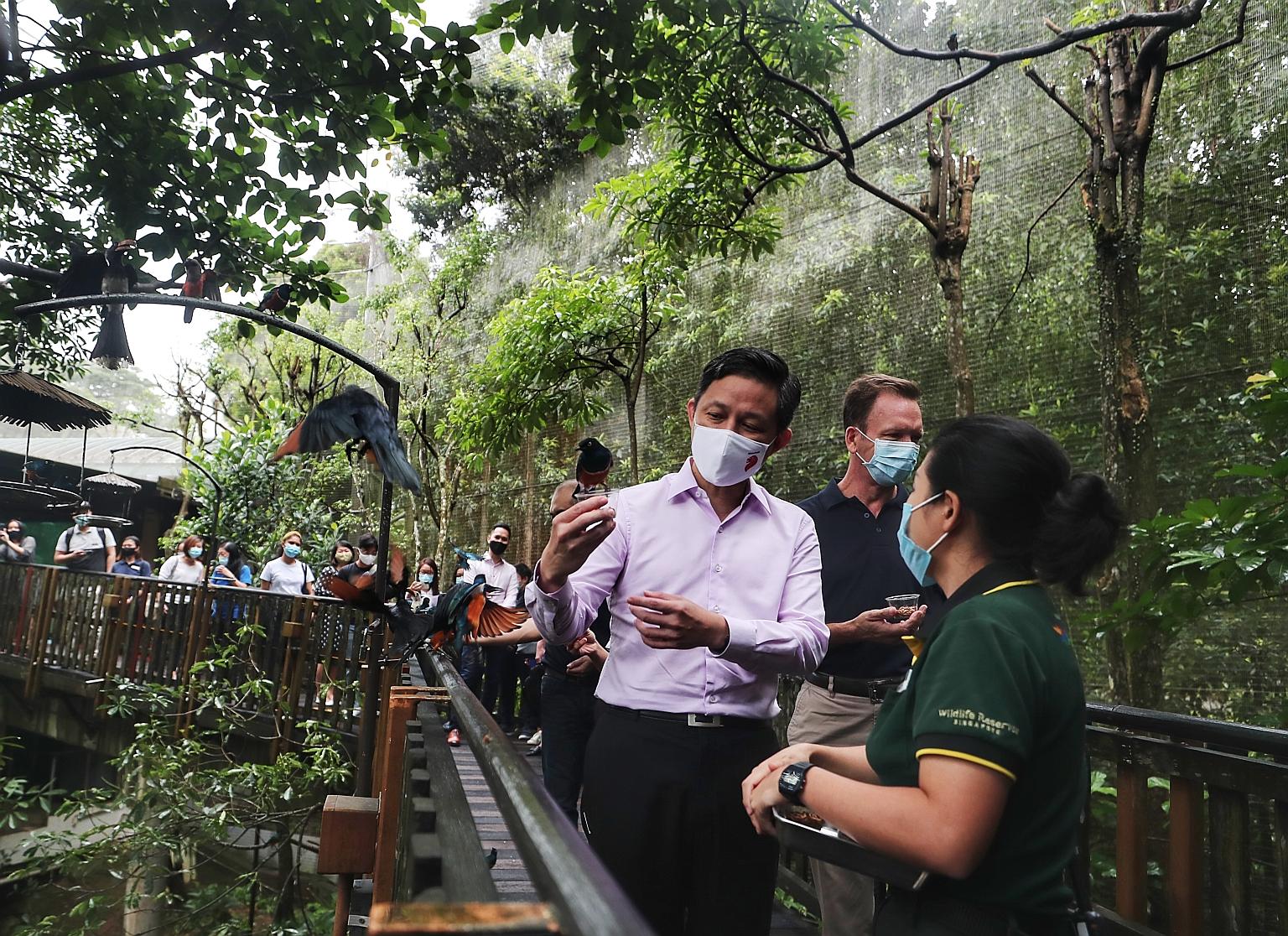 Trade and Industry Minister Chan Chun Sing, who unveiled details about the SingapoRediscovers Vouchers, on a visit to Jurong Bird Park yesterday with Mandai Park Holdings group chief executive Mike Barclay. Despite the pandemic-related setbacks, the 
