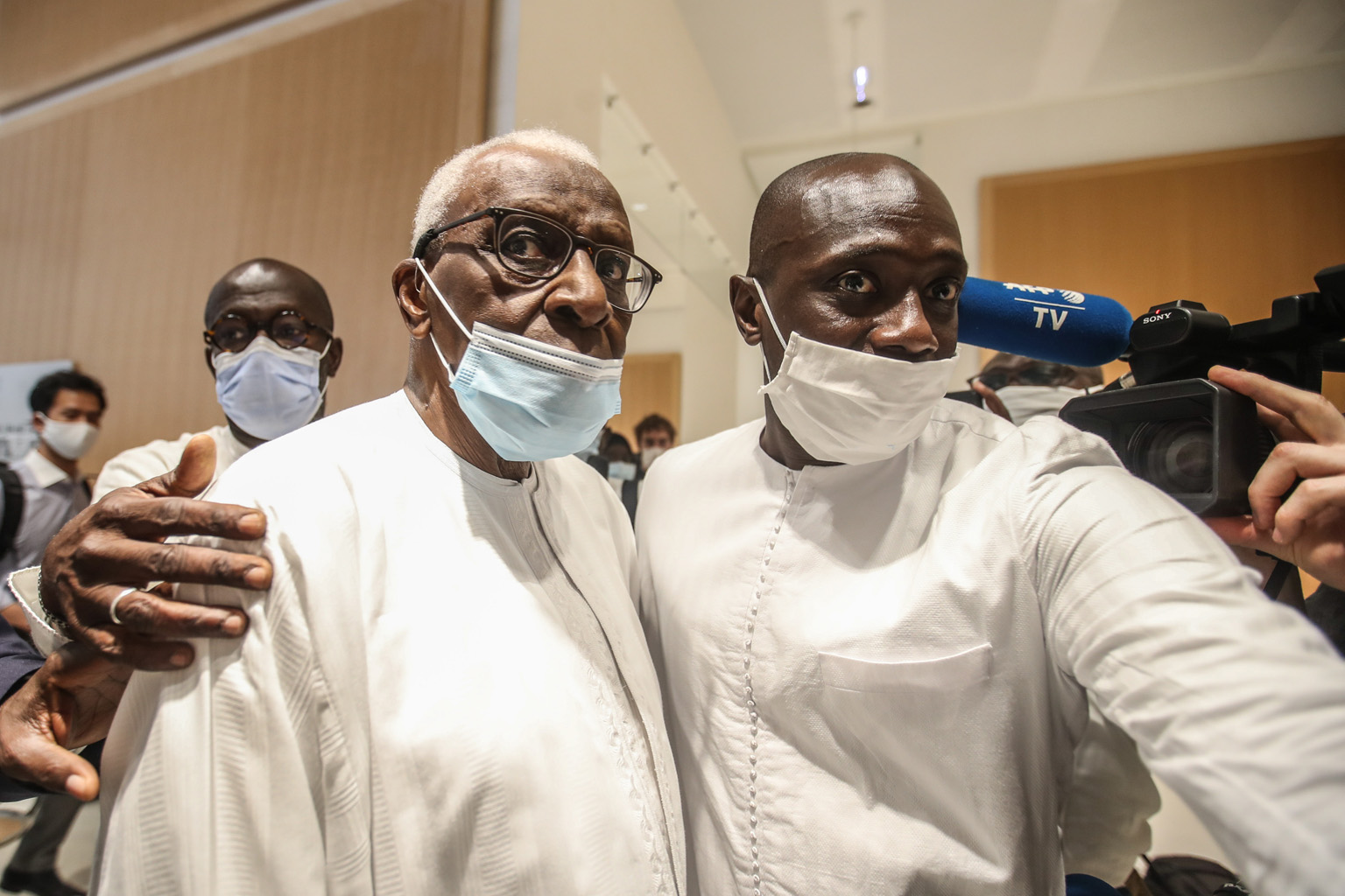 A French court has found Lamine Diack (middle), the former head of world athletics' governing body, guilty of taking bribes from athletes in return for orchestrating the cover-up of test results that enabled them to continue competing. PHOTO: EPA-EFE