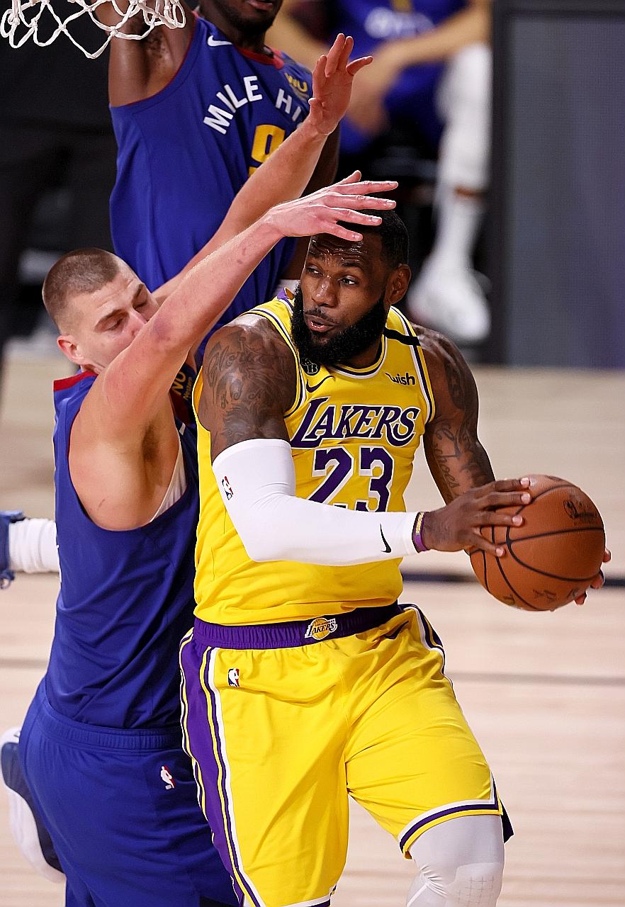 LA Lakers' LeBron James finds his way blocked by Denver Nuggets' Nikola Jokic during Game 1 of their NBA Western Conference Finals. James was upset after losing to the Milwaukee Bucks' Giannis Antetokounmpo in the NBA's MVP voting.
