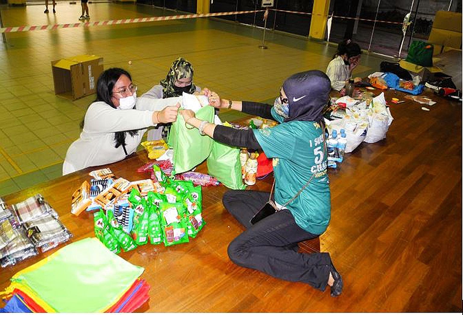 Sembawang Central Malay Activities Executive Committee members were among groups and individuals who helped put together care packs for migrant workers.