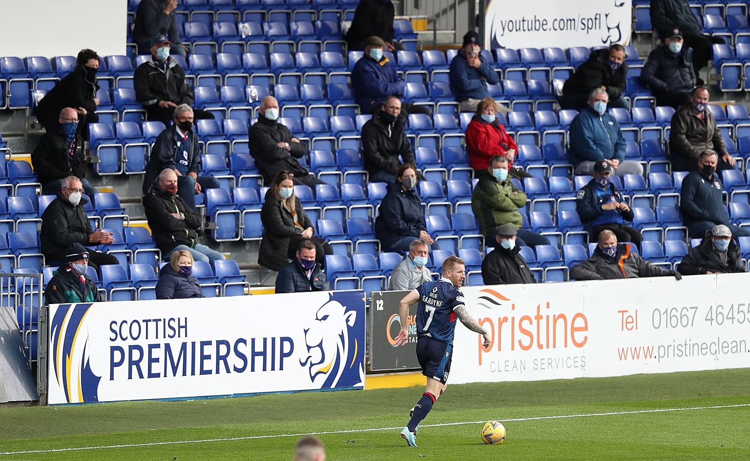 Fans observing safe distancing under pandemic curbs during a football match in Scotland earlier this month.