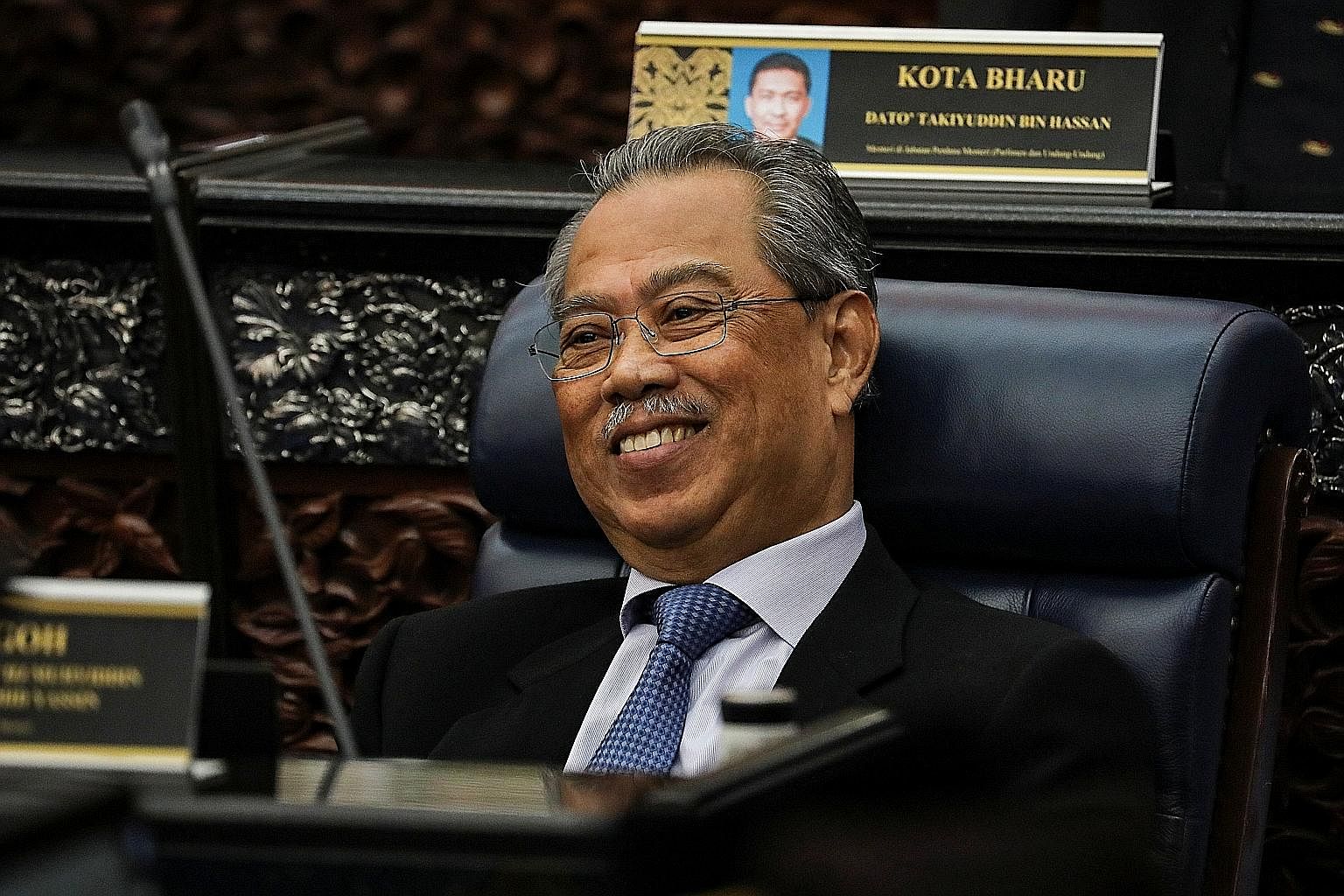 Prime Minister Muhyiddin Yassin in Parliament on July 13, when he won narrow backing to replace the Speaker. PHOTO: REUTERS Tun Dr Mahathir Mohamad leaving the National Palace on Feb 24, the day he resigned as prime minister. PHOTO: AGENCE FRANCE-PRE