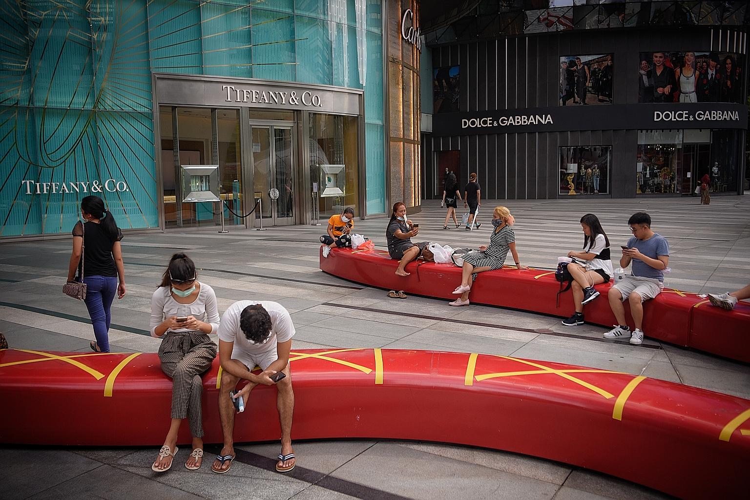People observing safe distancing outside Ion Orchard. The survey identified two main concerns regarding Covid-19: the fear of contracting the disease in public spaces, and worry about long-term economic disruption. ST PHOTO: MARK CHEONG