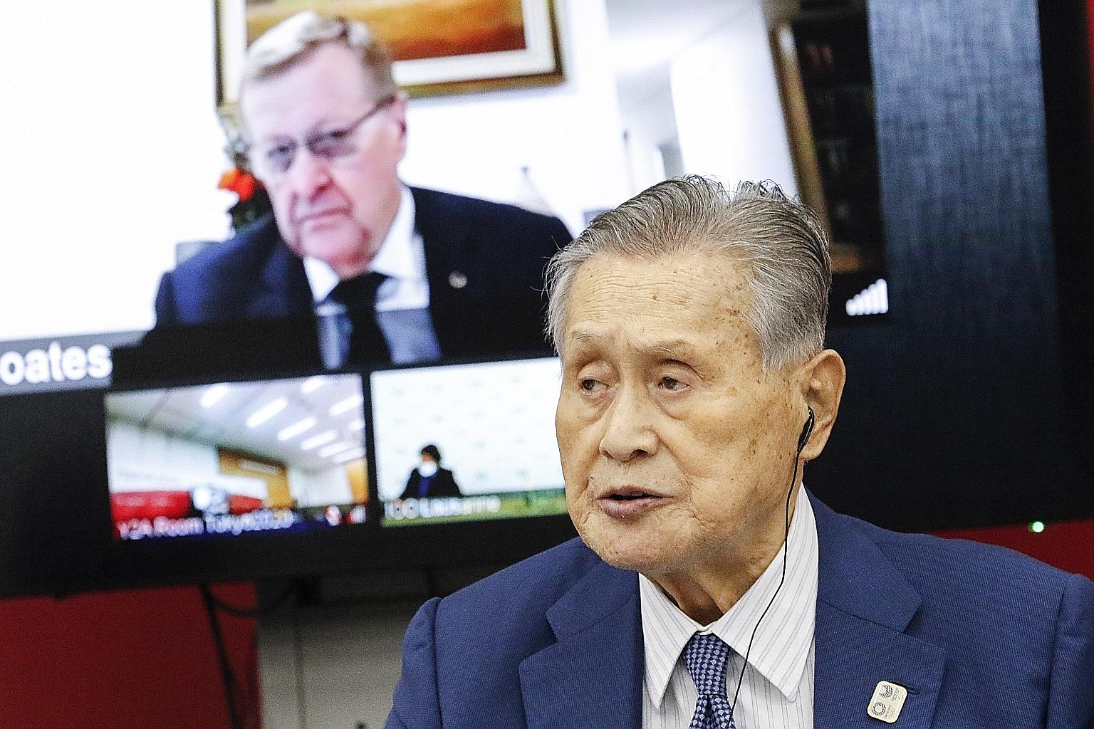 Tokyo Games Committee president Yoshiro Mori and IOC vice-president John Coates attending a press conference in Tokyo yesterday. Officials and organisers have agreed on over 50 cost-cutting measures.