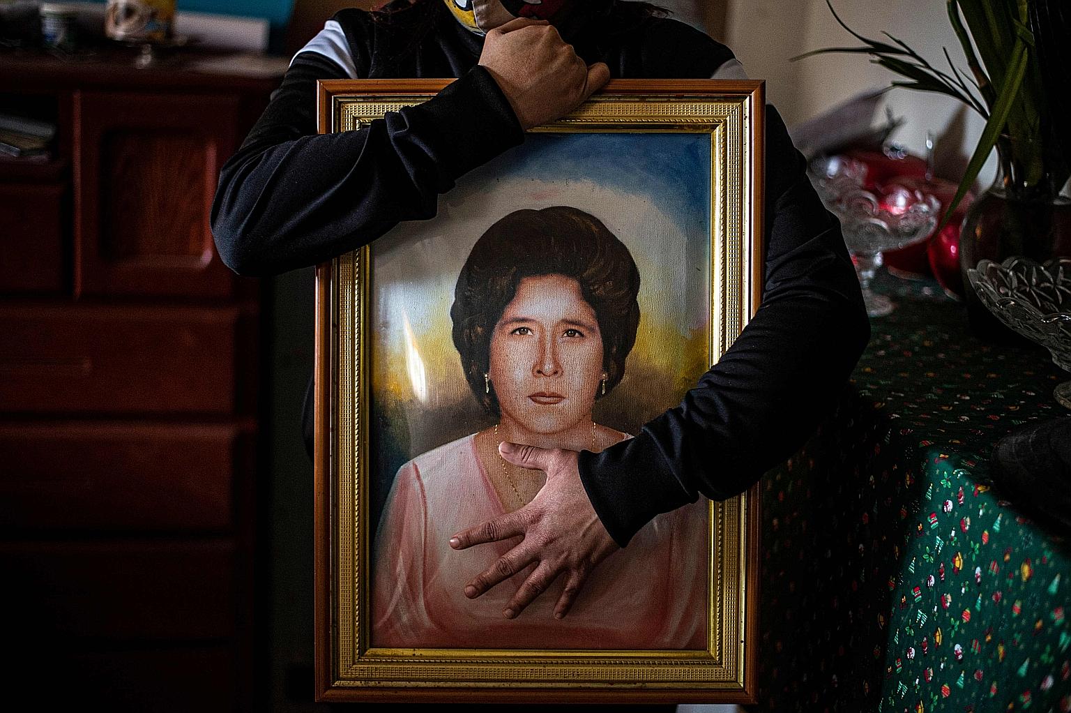 ARGENTINA: Healthcare workers in Buenos Aires observing a minute of silence for colleagues who died from Covid-19, in a protest to demand better working conditions last month. Argentina has had over 14,700 deaths. PERU: Ms Liset Diaz, 35, holding a p