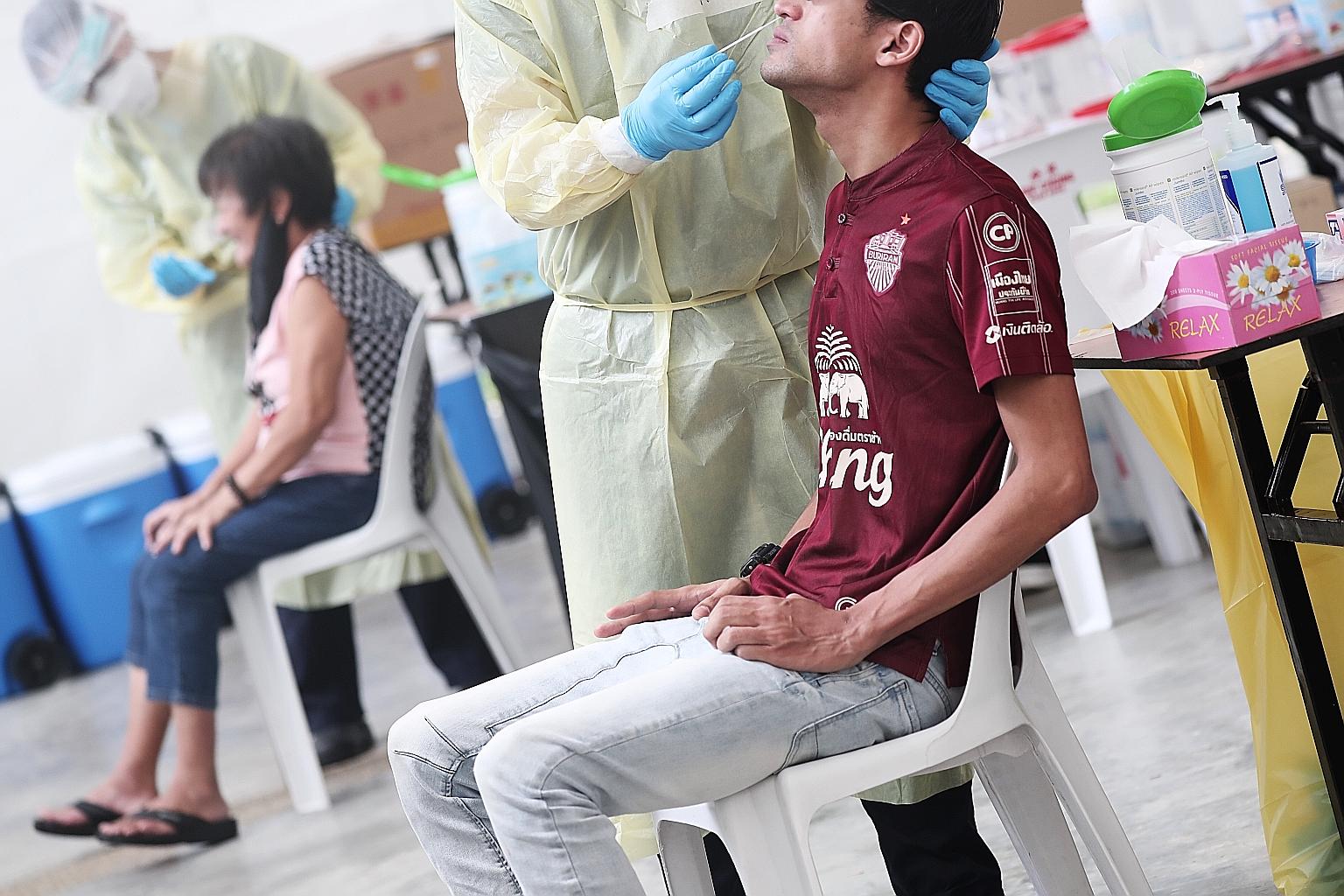 A testing centre located at the pavilion beside Block 75 Marine Drive. Both the number of new daily cases in the community in a week and the number of unlinked cases in the community have remained stable. ST PHOTO: KELVIN CHNG