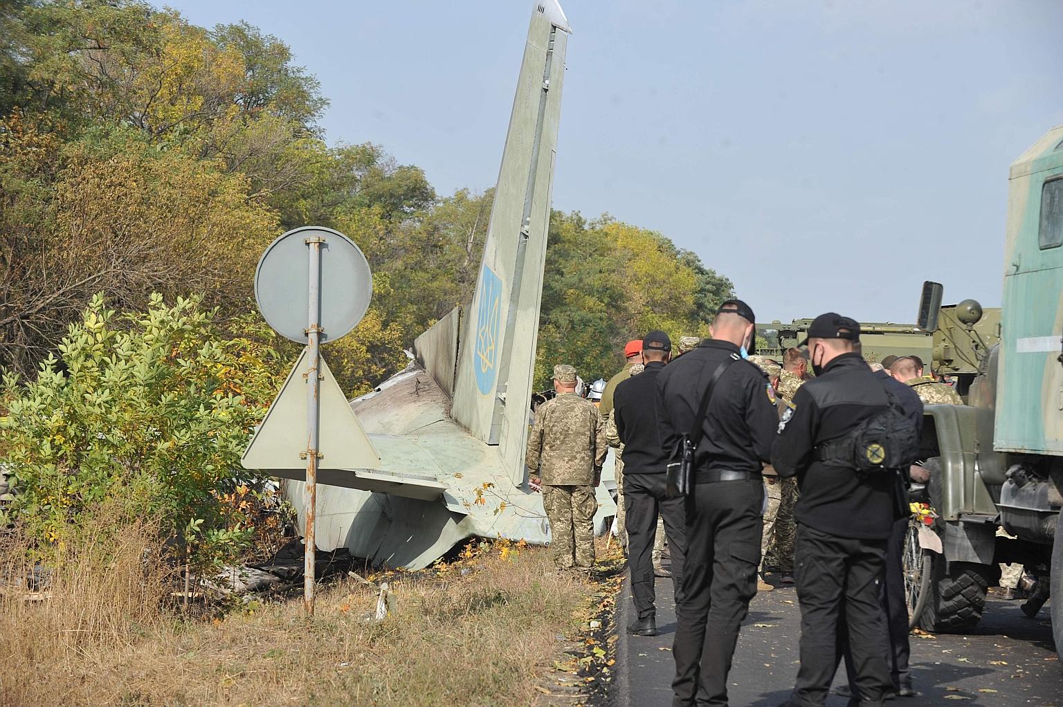 Military personnel at the crash site. The transport plane was carrying 20 cadets and seven crew when it went down.