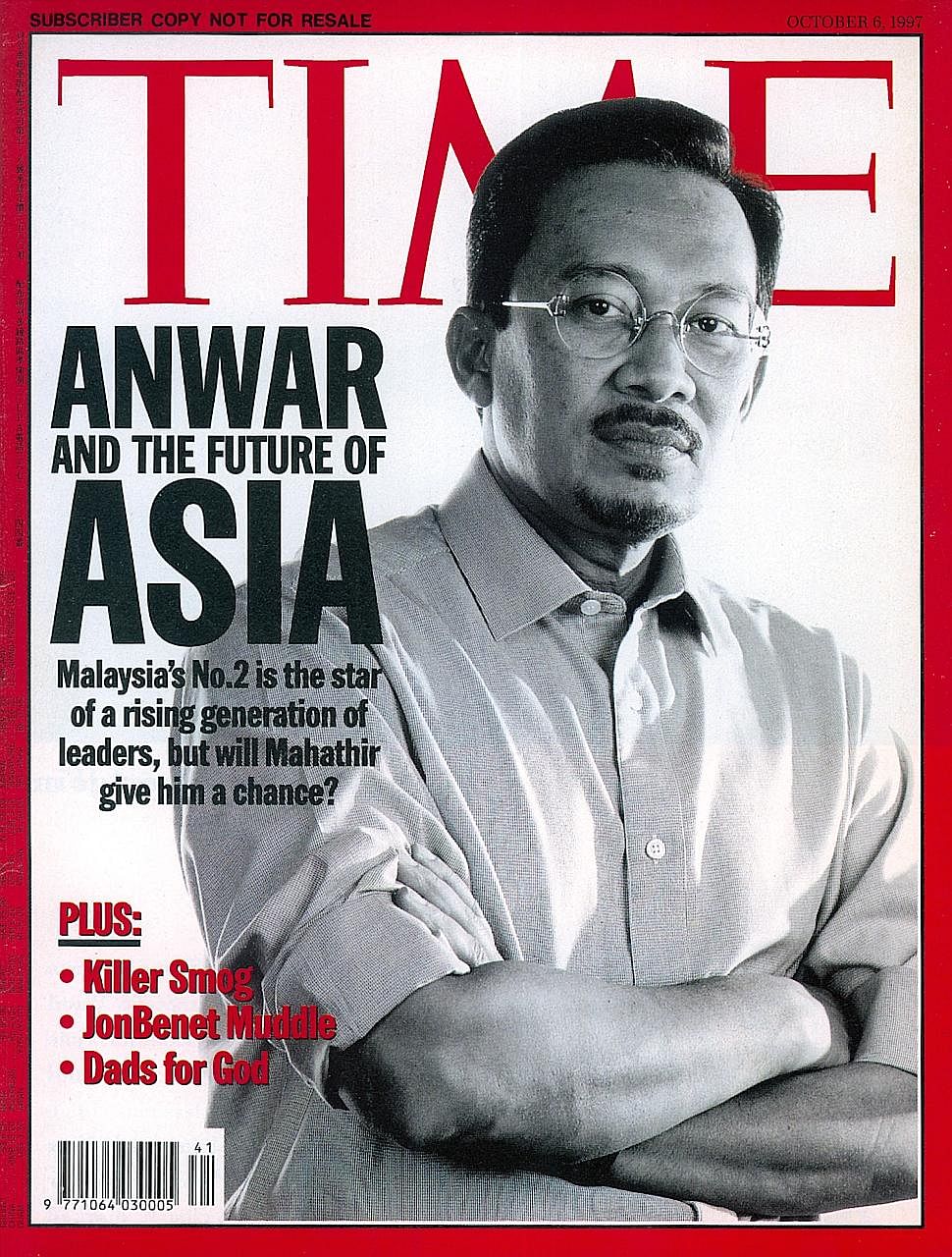 Right: On the cover of Time magazine in 1997. Far right: Mr Anwar being protected by supporters as police arrest him on Sept 20, 1998.