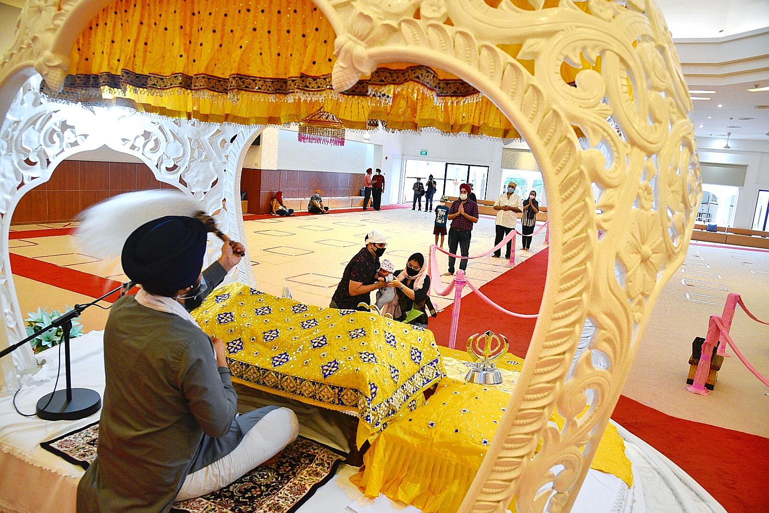 The prayer hall of the Central Sikh Temple in Towner Road yesterday. The temple is among 16 religious organisations that can resume live music during worship services from Saturday in a pilot project. ST PHOTO: DESMOND WEE