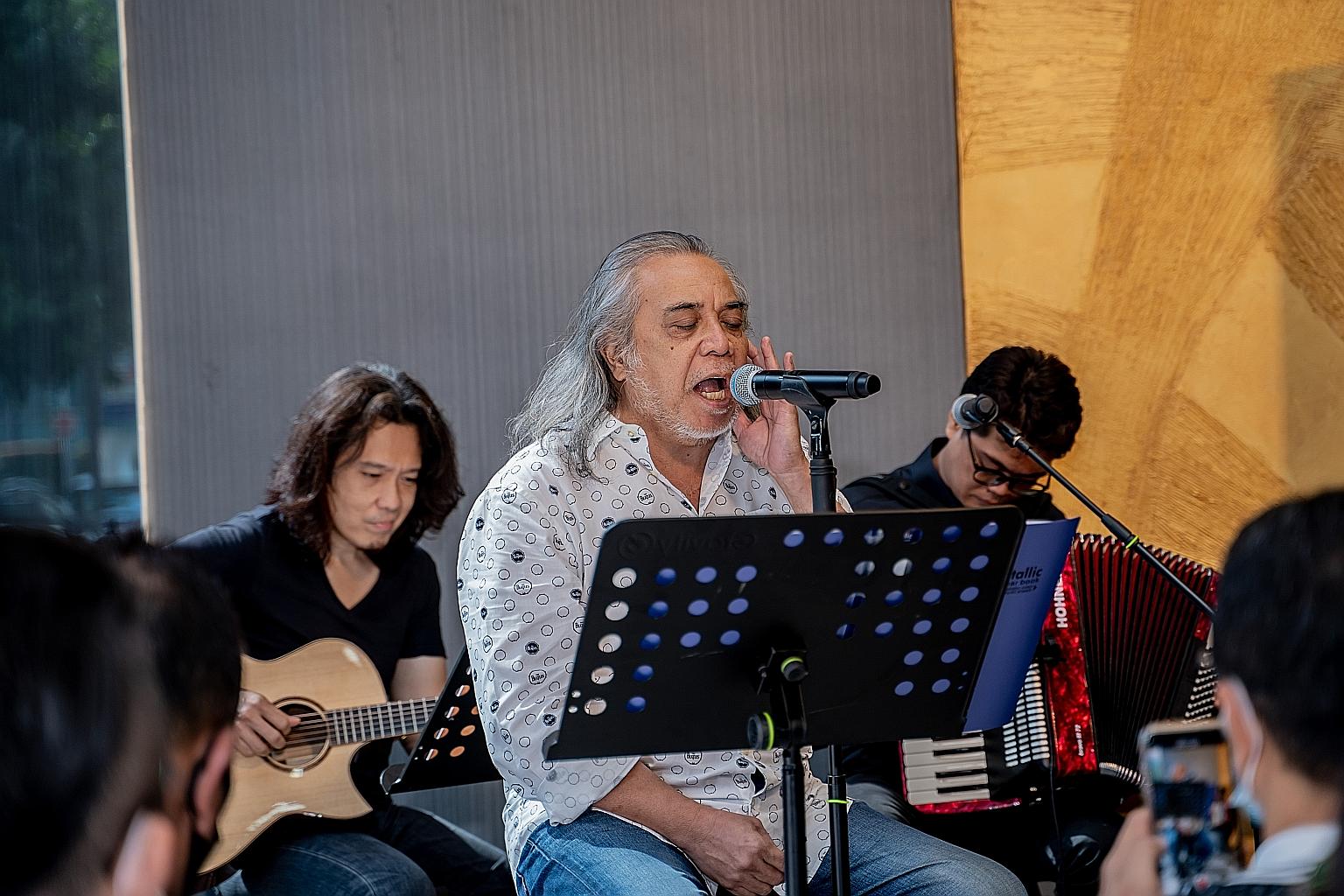 Music veteran Ramli Sarip (centre) giving a preview of his 23rd album by singing two folk-tinged songs that will be included, Cinta Di Sebalik Musim (Love Beyond The Seasons) and Srikandi Zaman (Heroines Of The Ages).