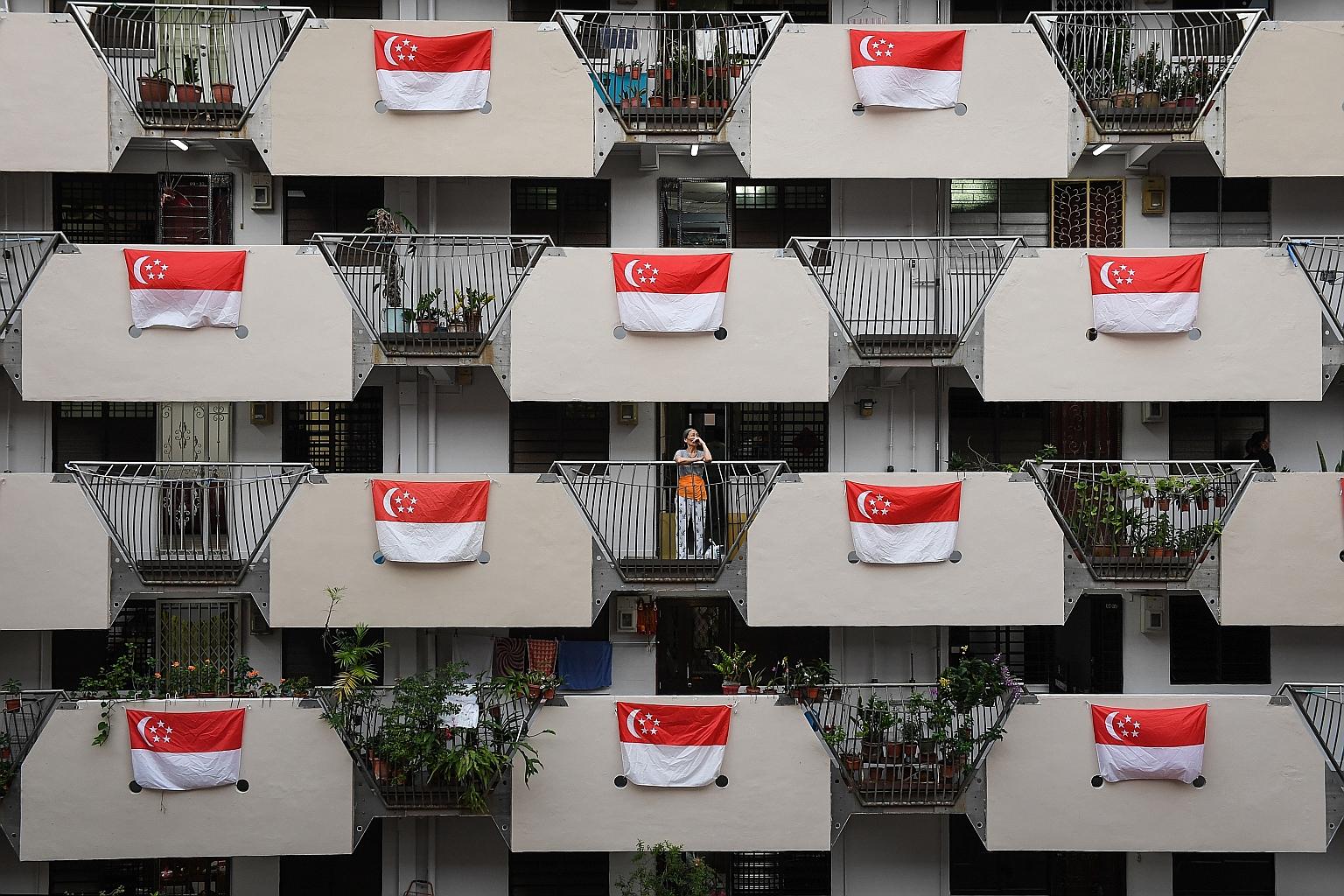 Singapore flags at Block 9 Selegie Road in July. Every year, the flag can be displayed outside a building or in an open space without a flagpole between July 1 and Sept 30. But the start date was brought forward to April 25 this year to allow the fla