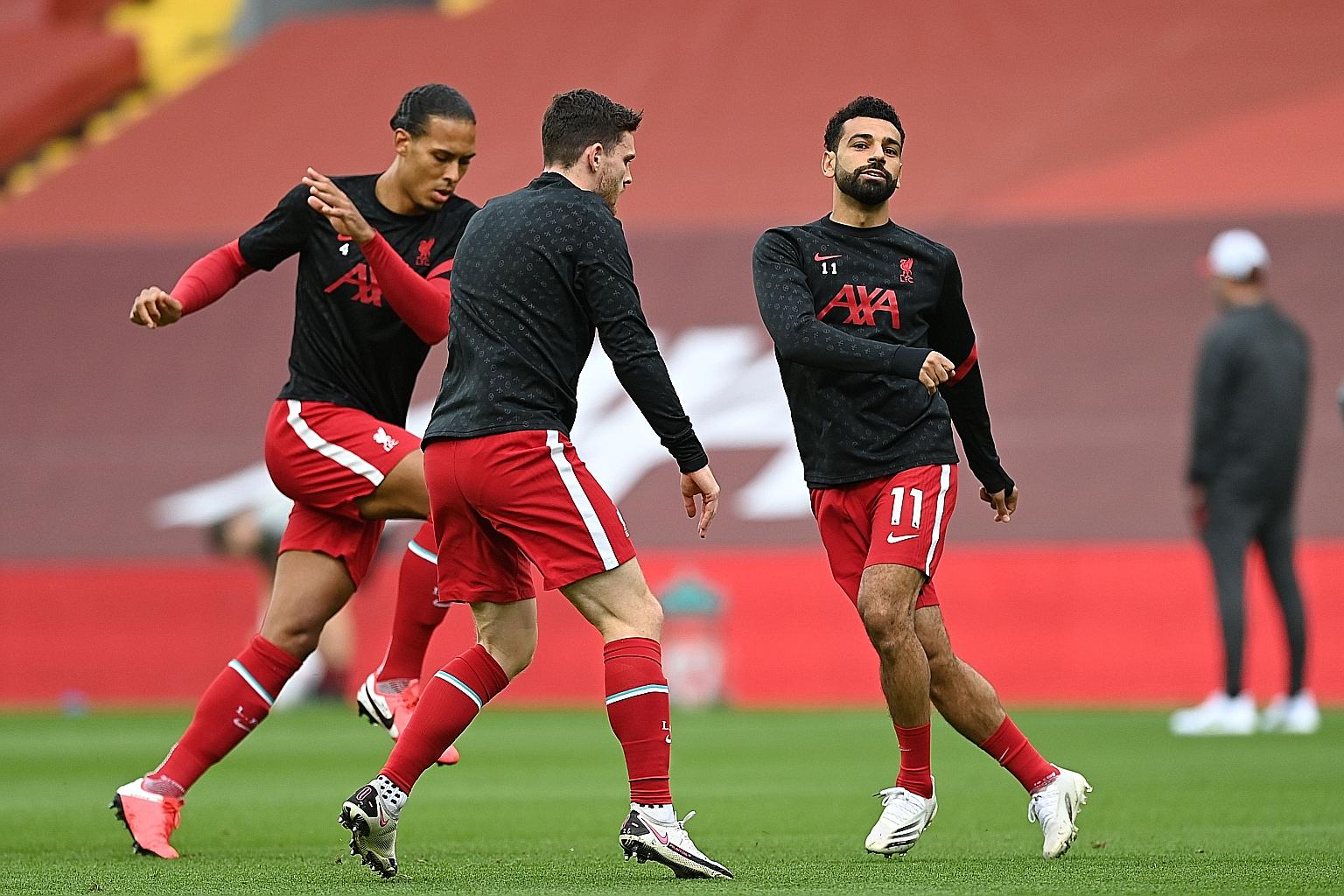 Virgil van Dijk, Andy Robertson and Mohamed Salah are all set to start for Liverpool in today's Premier League home clash against Arsenal. On the line is a 60-game undefeated streak at Anfield, going back 41 months. PHOTO: AGENCE FRANCE-PRESSE