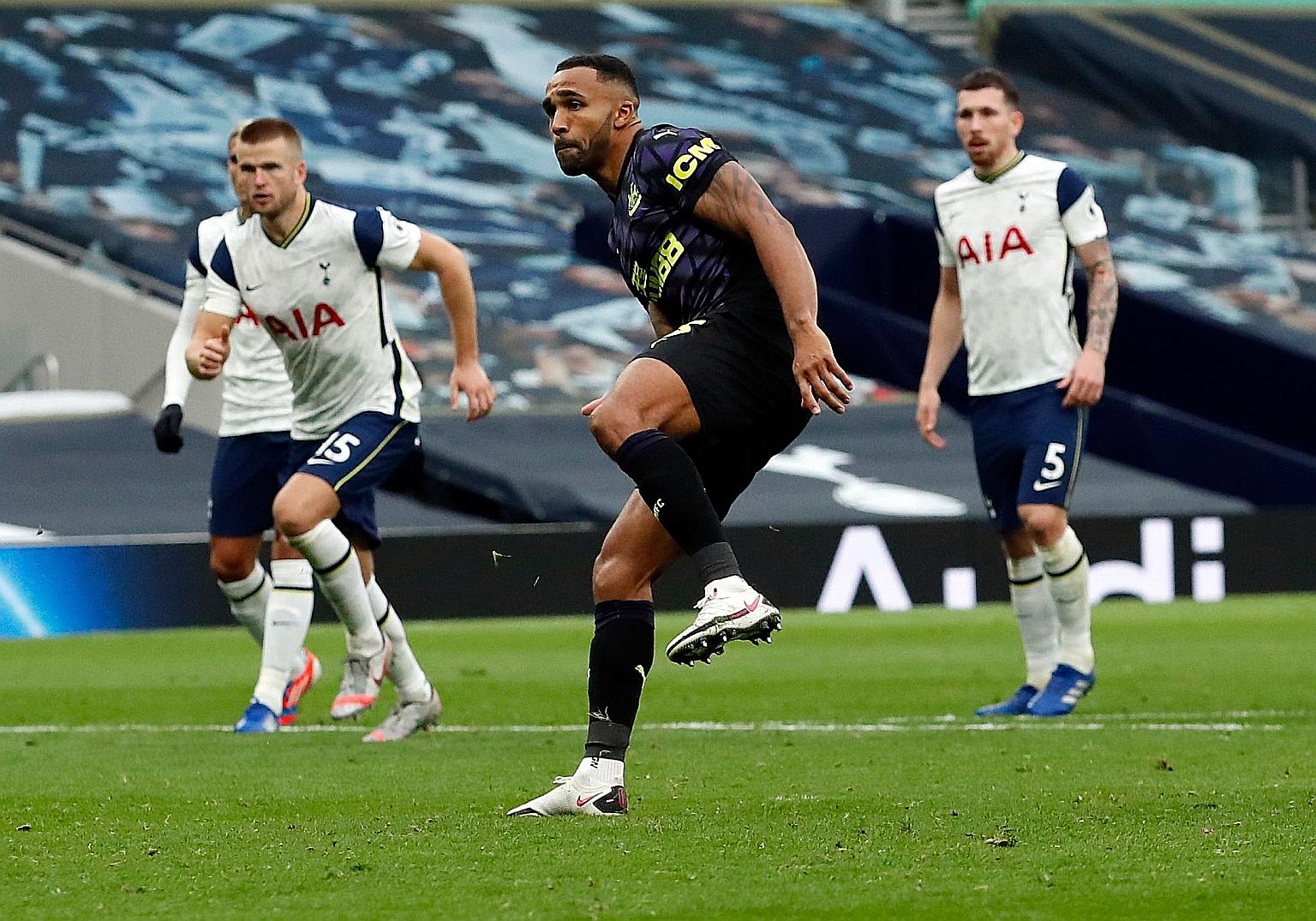 Callum Wilson converting a penalty for Newcastle to seal a late equaliser against Tottenham. The awarding of the spot kick for a handball by Eric Dier (background) was so controversial, it prompted Wilson's manager Steve Bruce to denounce it. PHOTO: